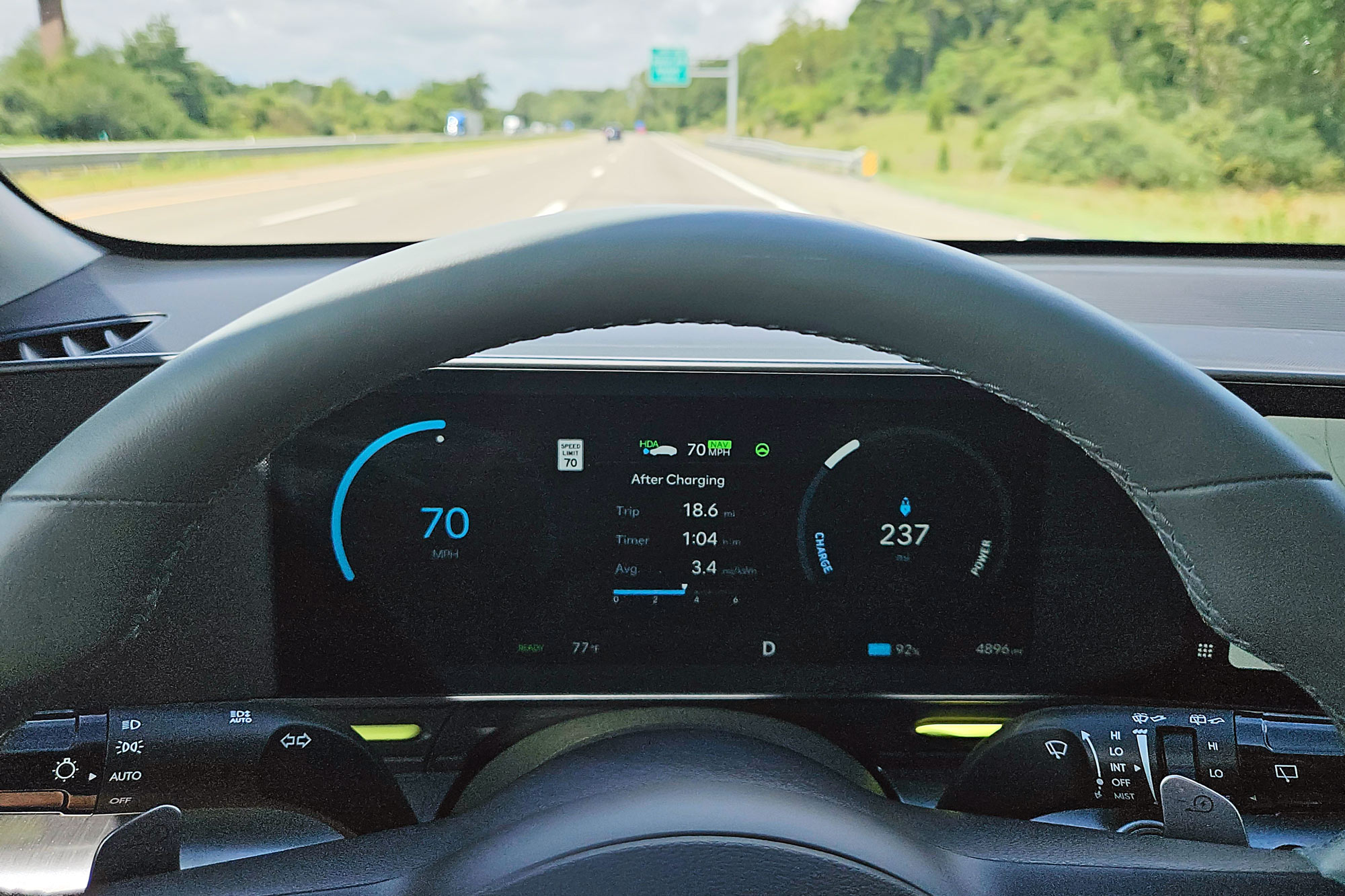 2024 Hyundai Kona Electric Limited digital dashboard driving on the highway