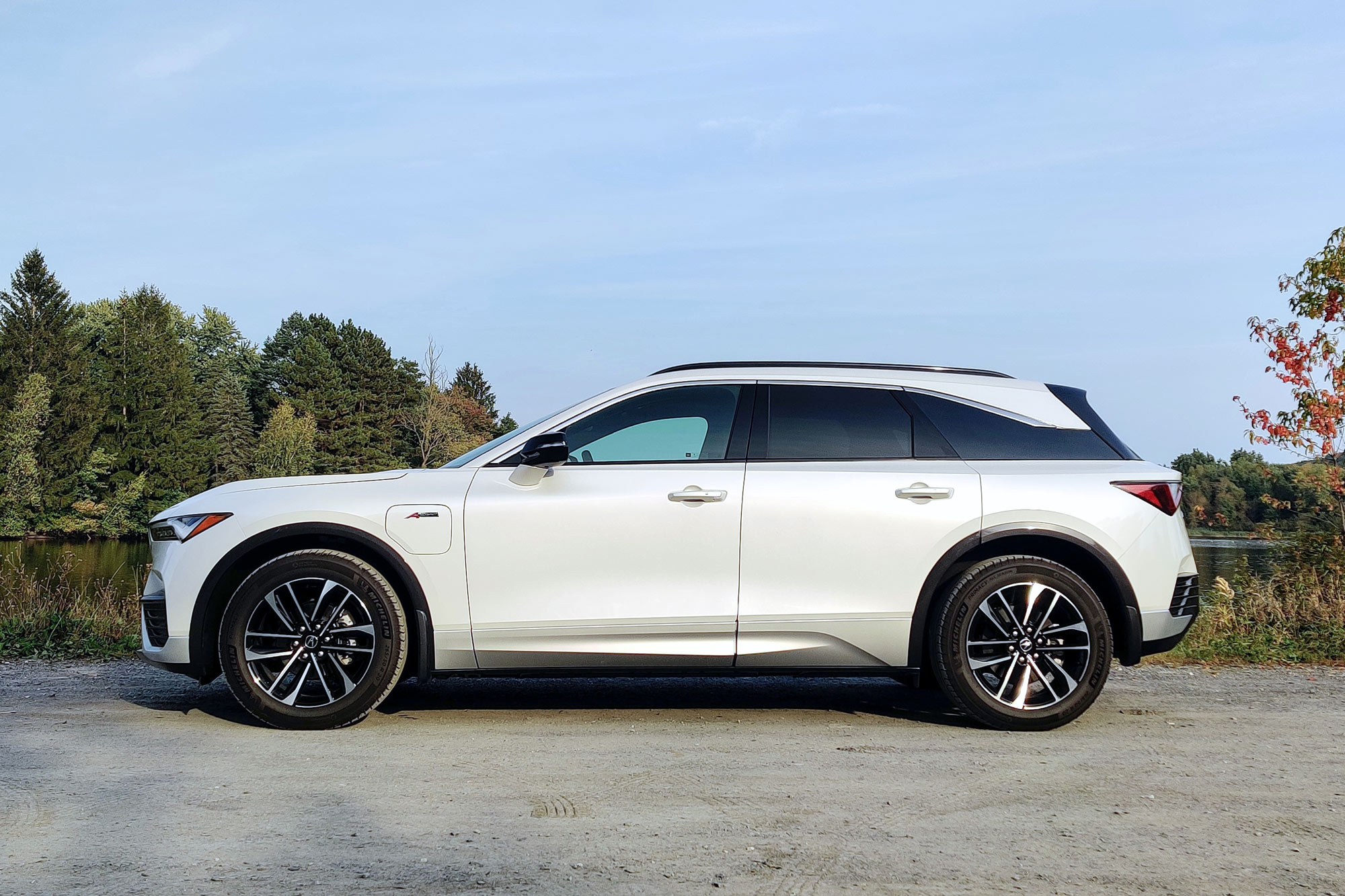 Side of a 2024 Acura ZDX A-Spec AWD in Snowfall Pearl