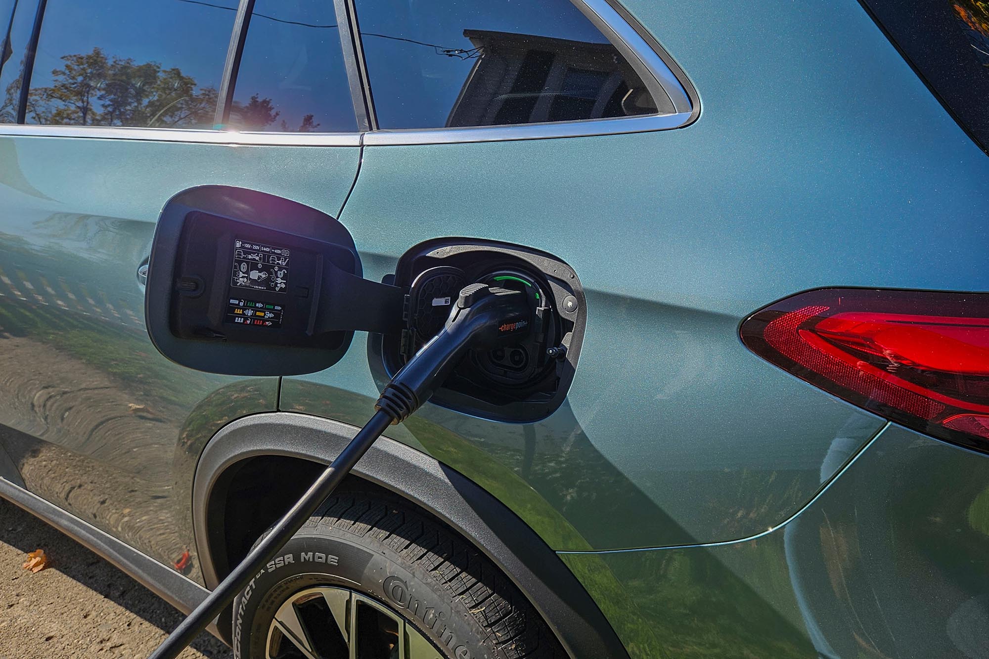 2025 Mercedes-Benz GLC 350e in Verde Silver plugged in and charging.