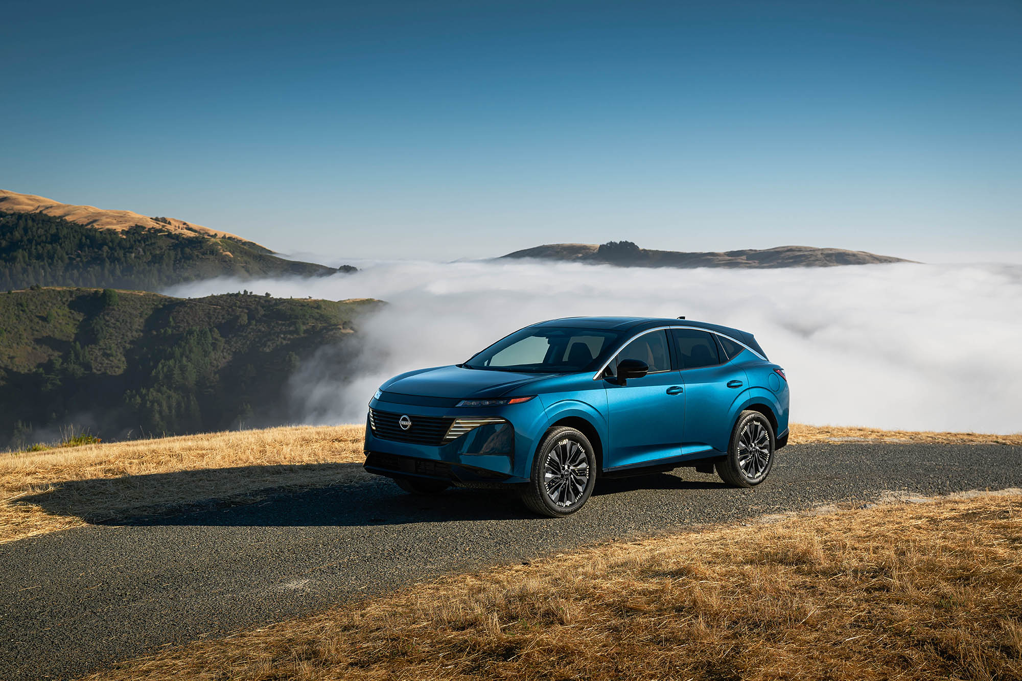 2025 Nissan Murano in blue parked above the clouds