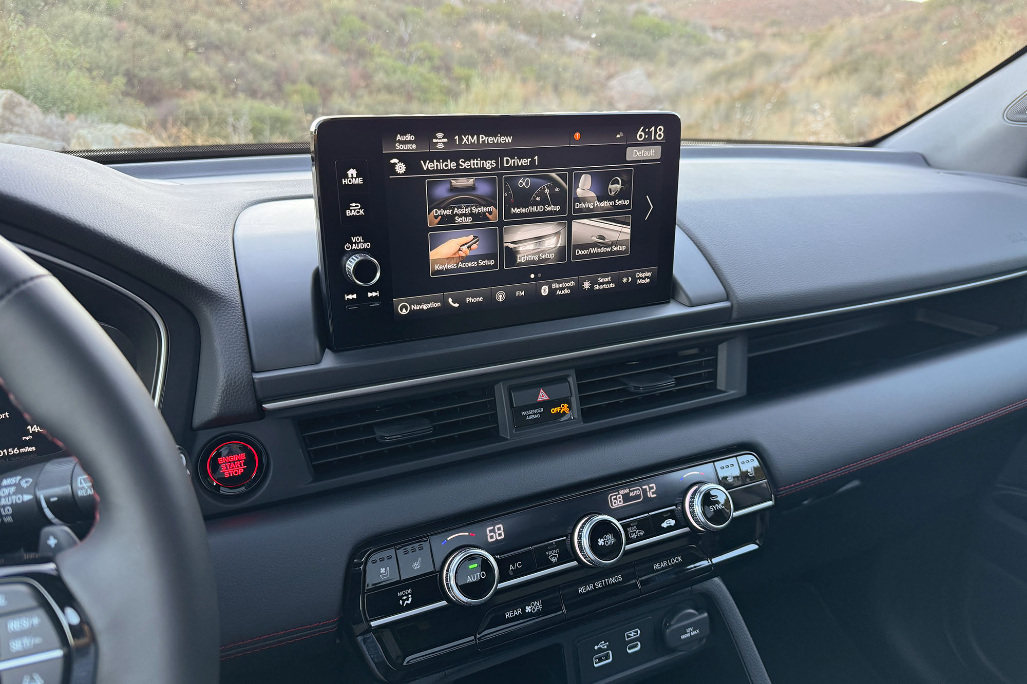 2025 Honda Pilot Black Edition interior showing the infotainment system and climate controls.