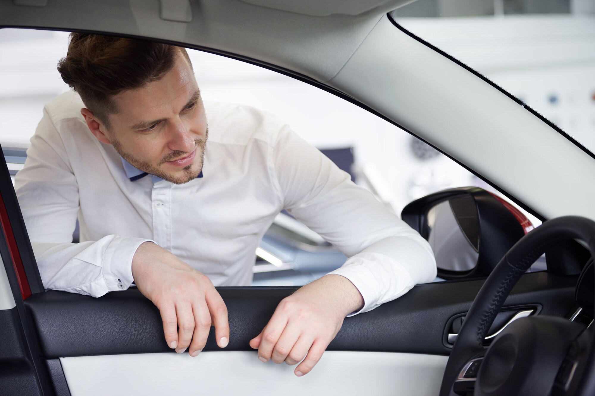 Person looks inside car