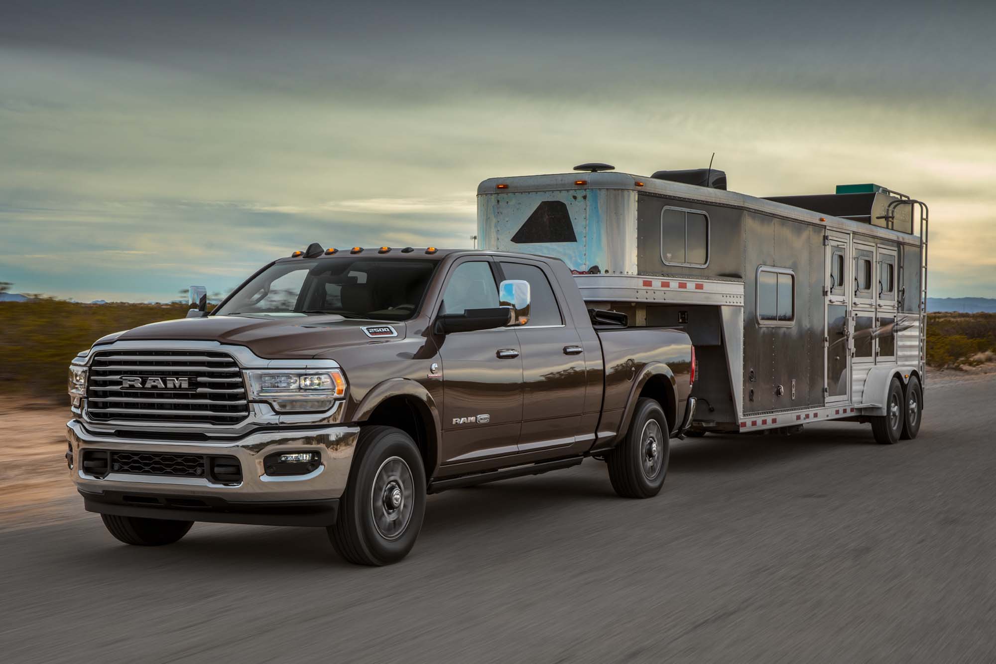 A 2024 Ram 2500 Limited Longhorn towing a trailer.