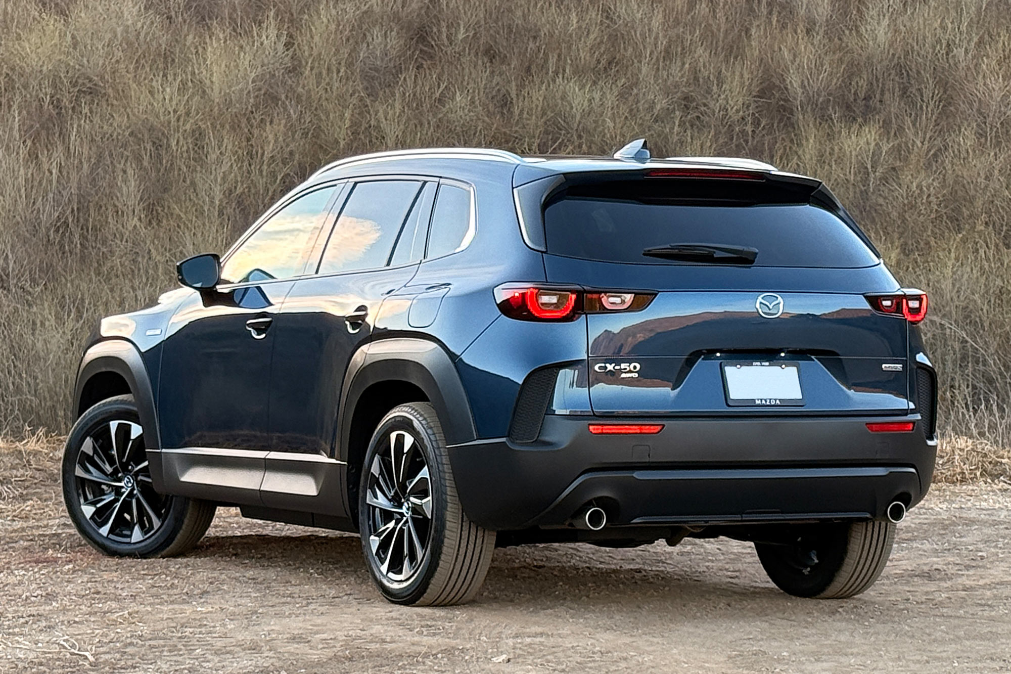 An Ingot Blue 2025 Mazda CX-50 Hybrid Premium Plus