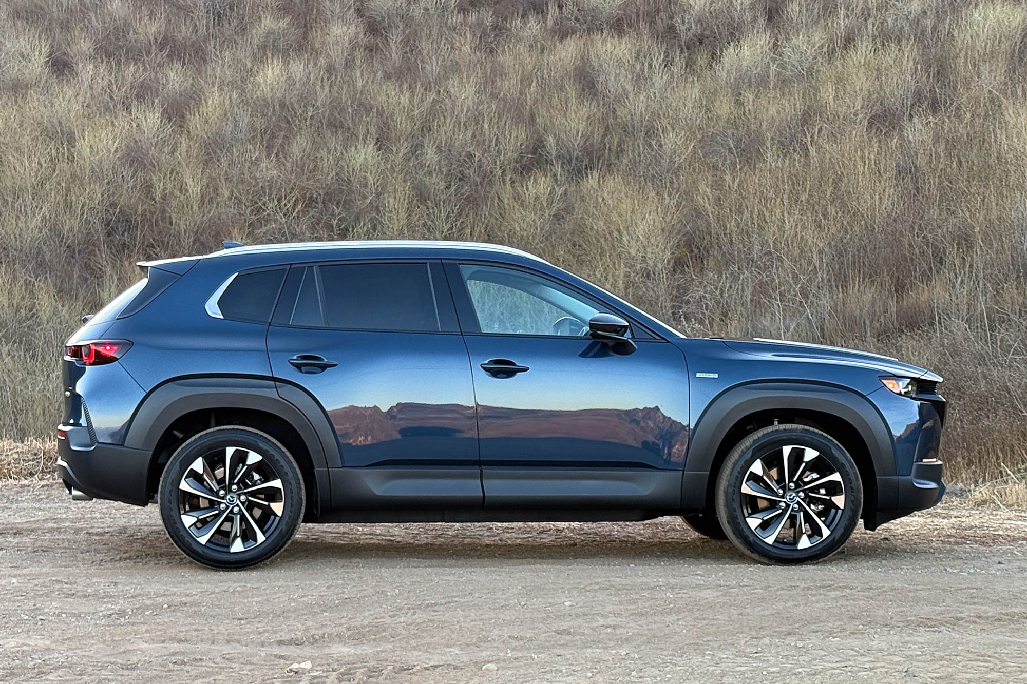 An Ingot Blue 2025 Mazda CX-50 Hybrid Premium Plus