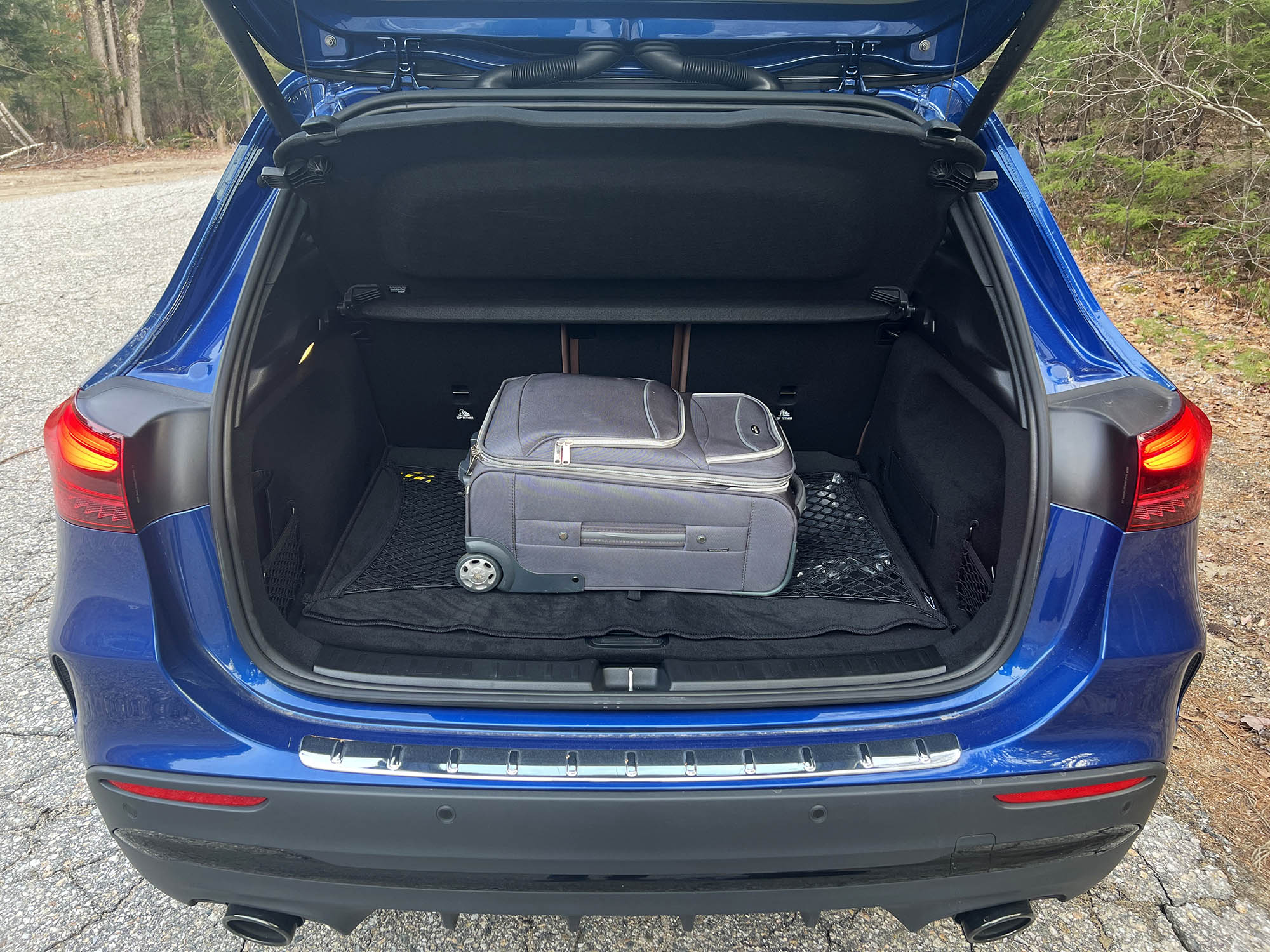 2024 Mercedes-AMG GLA 35 cargo area with a carry-on suitcase loaded