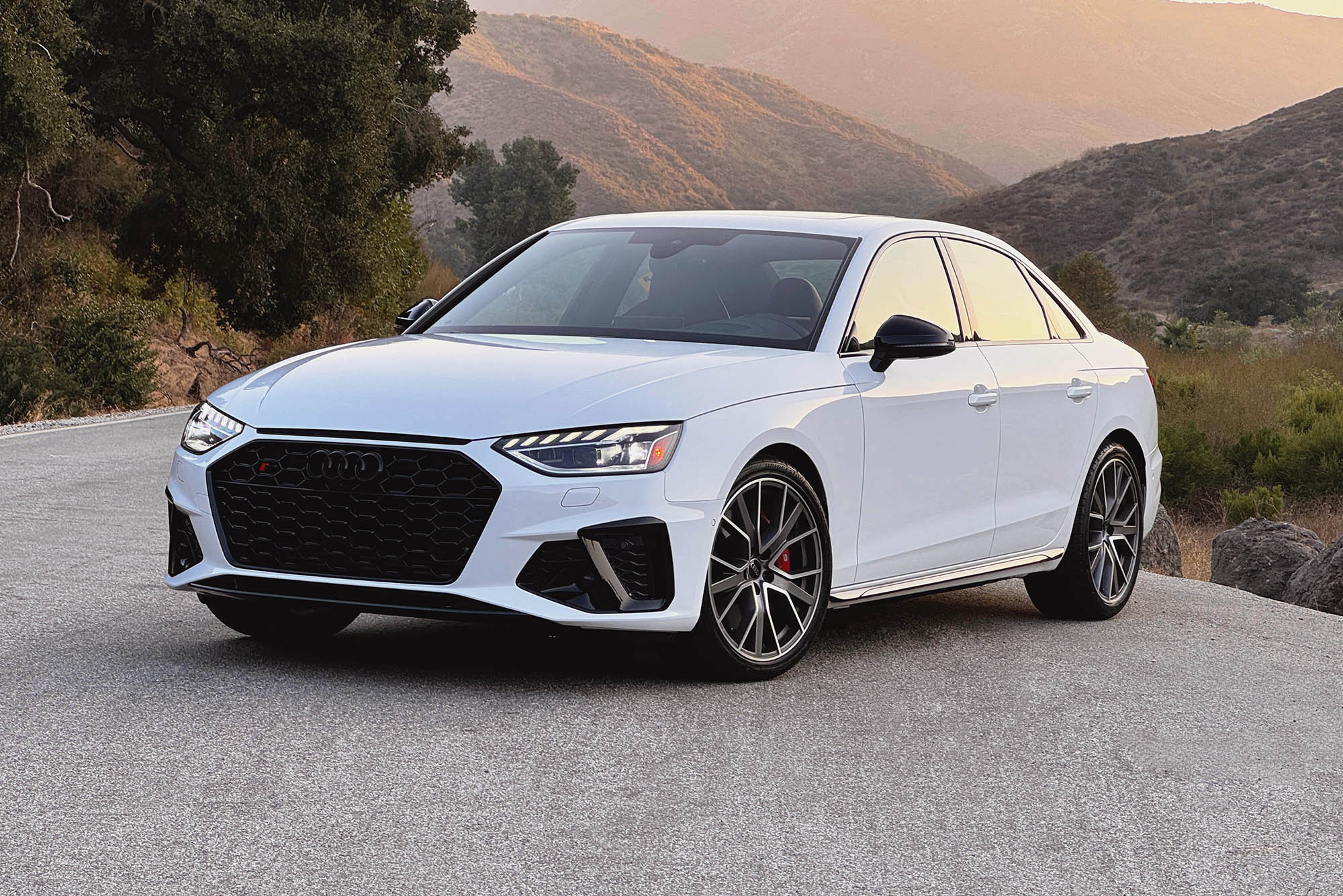 2025 Audi S4 in Arkona White with mountains in the background.