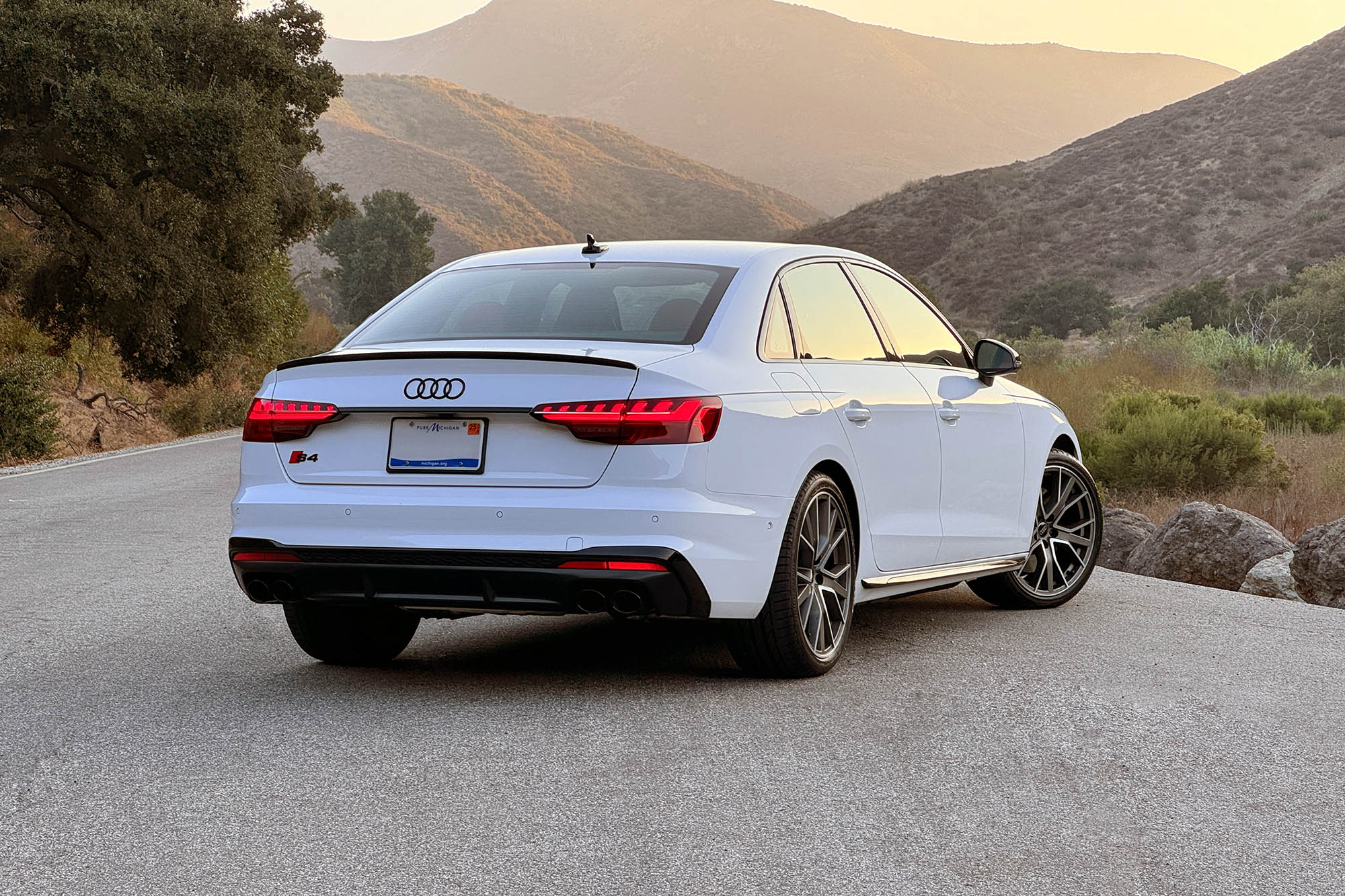 2025 Audi S4 in Arkona White with mountains in the background.