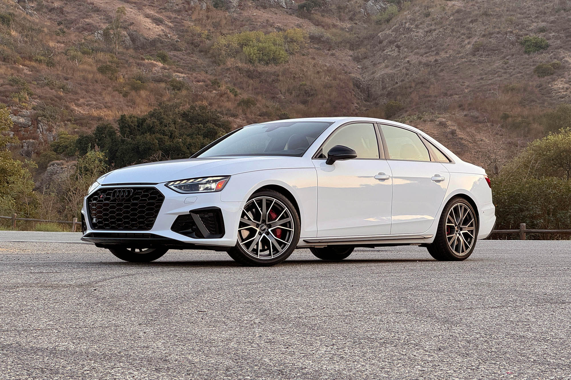 2025 Audi S4 in Arkona White with a mountain in the background.