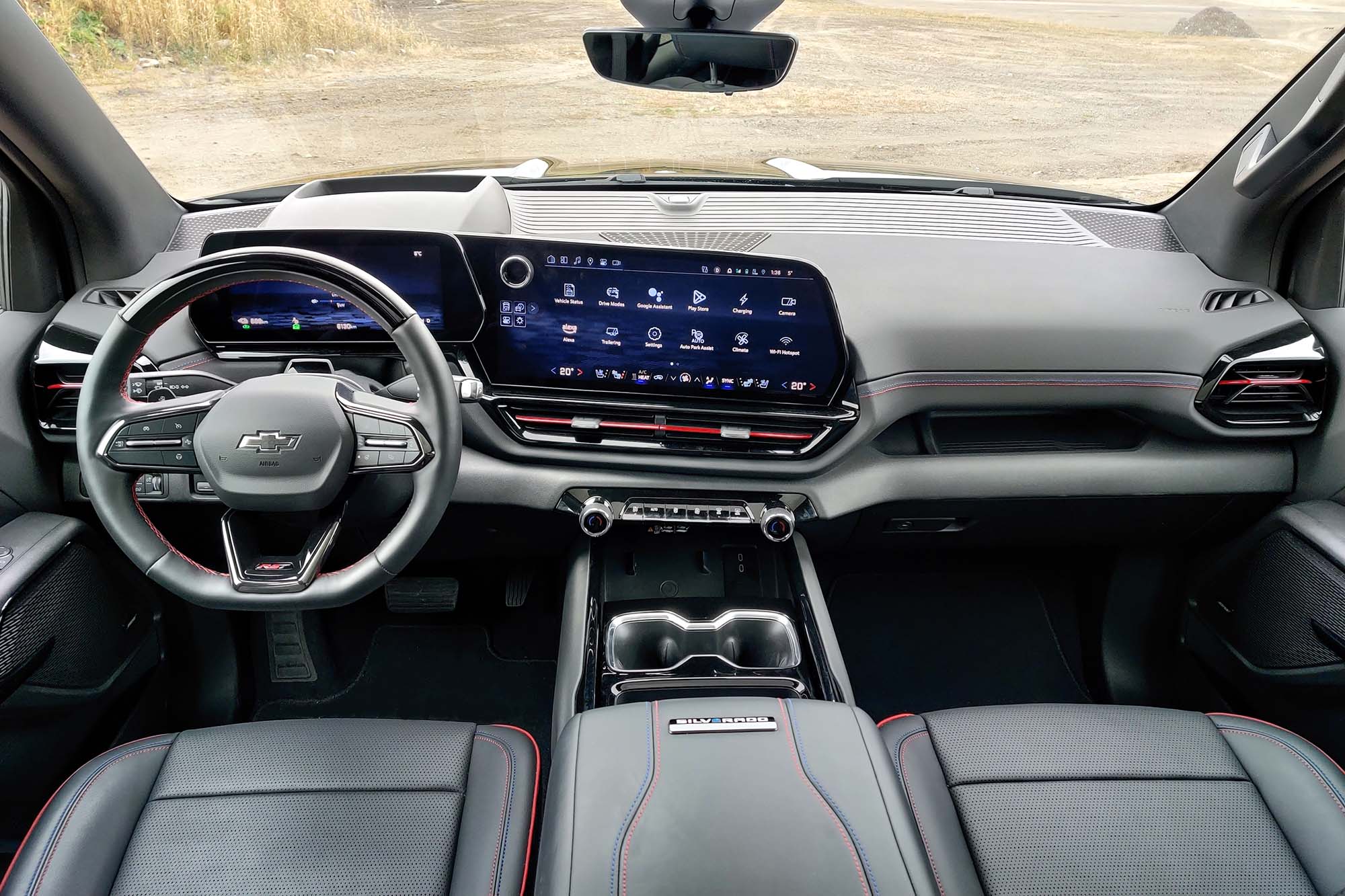 2025 Chevrolet Silverado EV First Edition RST interior showing the dashboard and front seats.