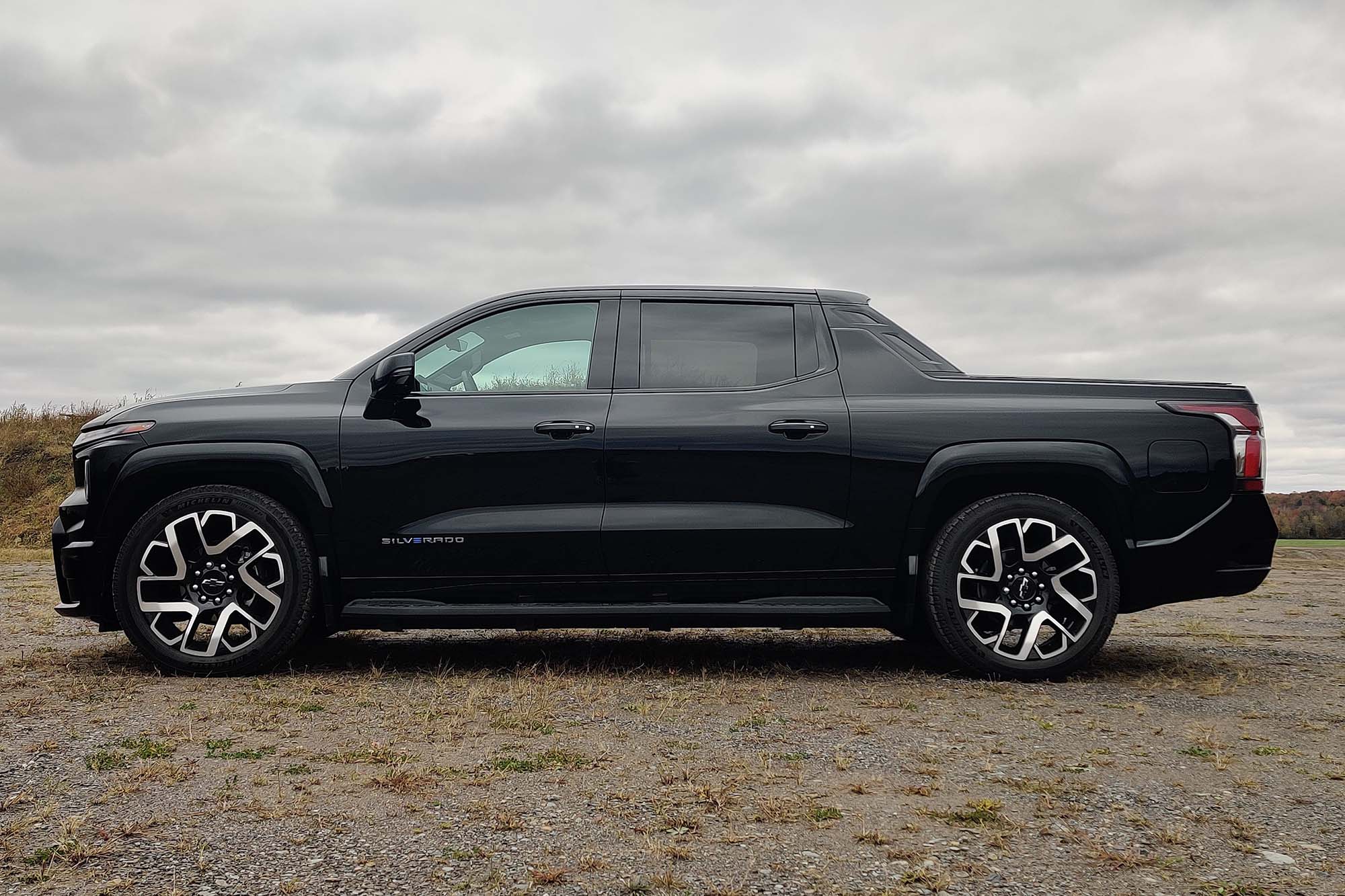 2024 Chevrolet Silverado EV First Edition RST in Black with gray sky in the background.