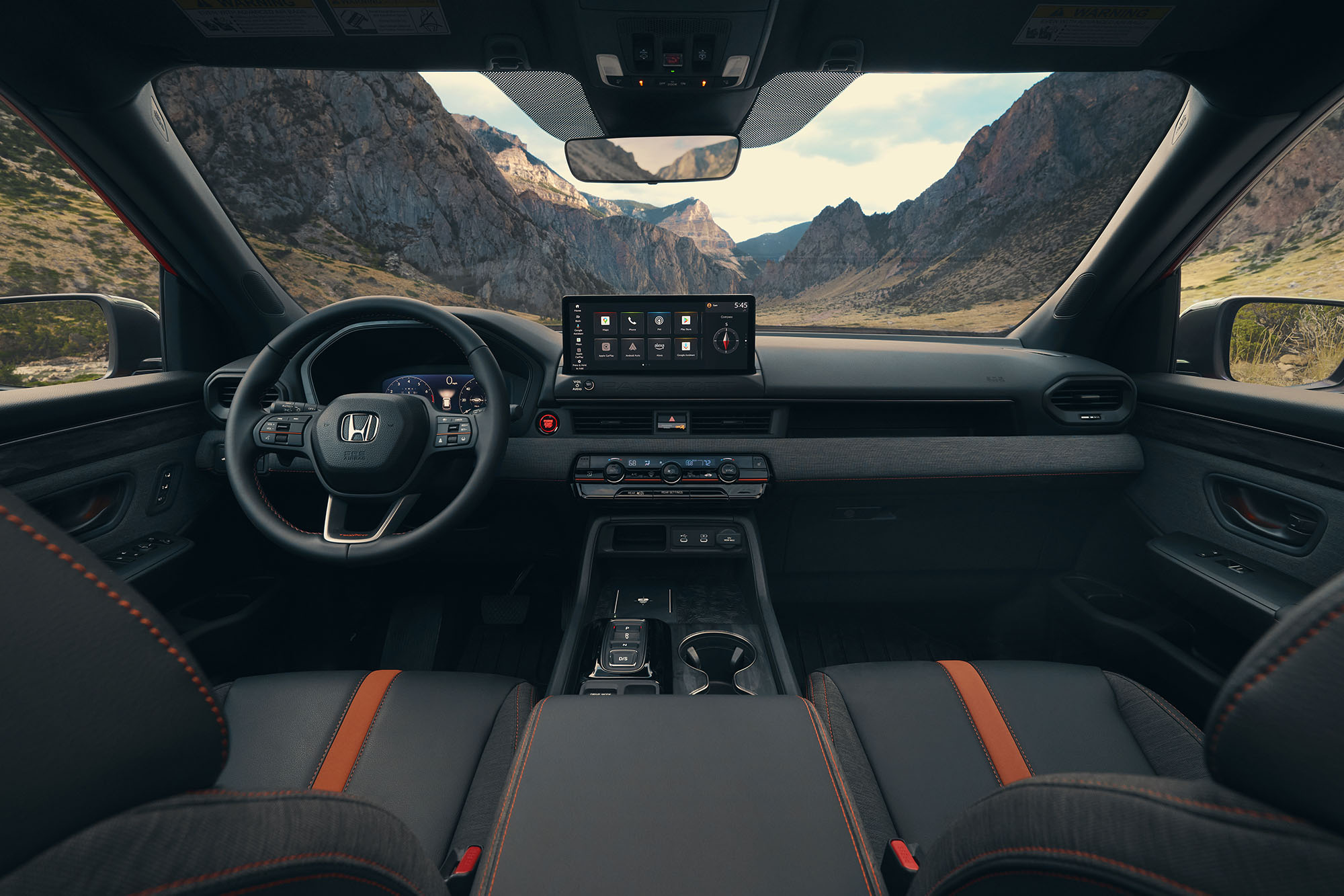 The front seats and dashboard of a 2026 Honda Passport TrailSport