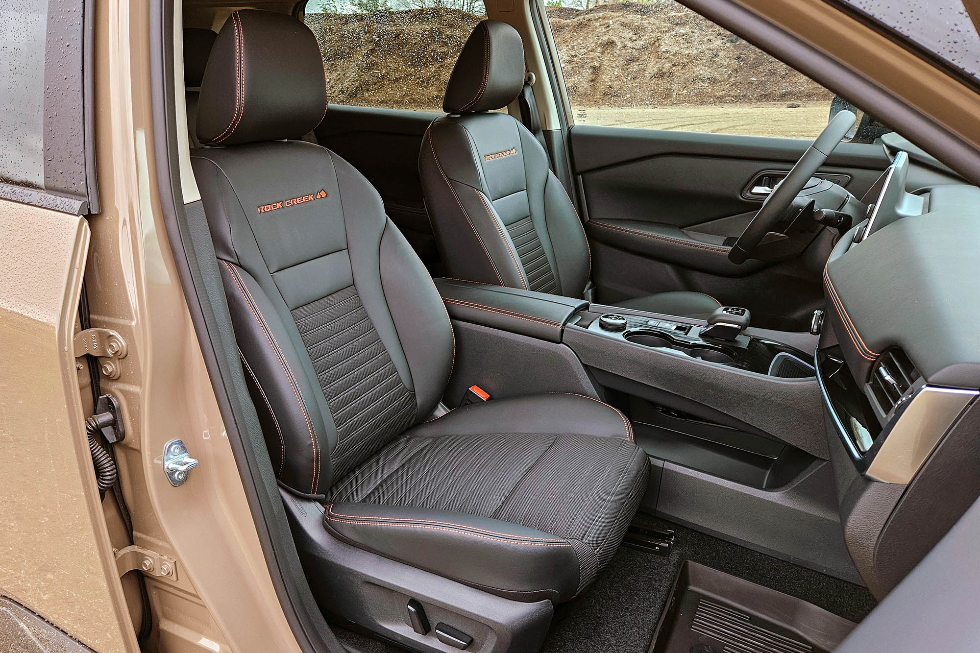 2025 Nissan Rogue Rock Creek interior in Charcoal, passenger side