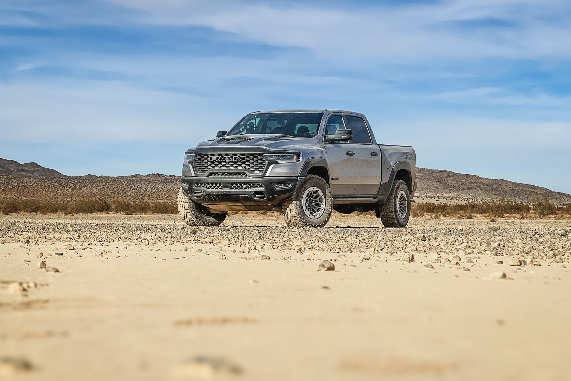 2025 Ram 1500 RHO in Billet Silver Metallic over Diamond Black Crystal Pearl parked in Johnson Valley, California.