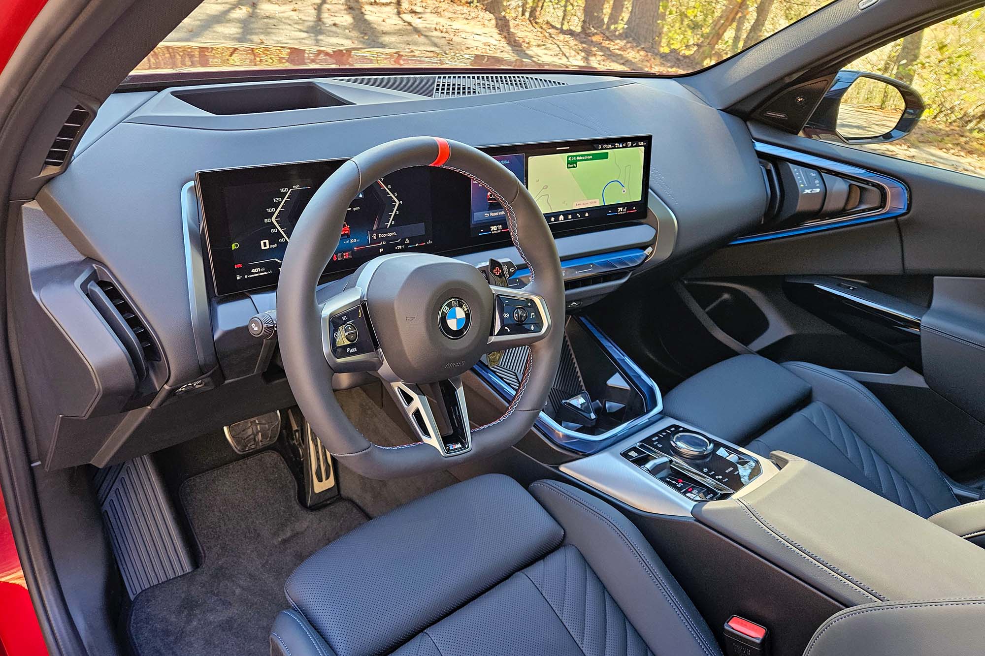 The front seats and dashboard of a 2025 BMW X3