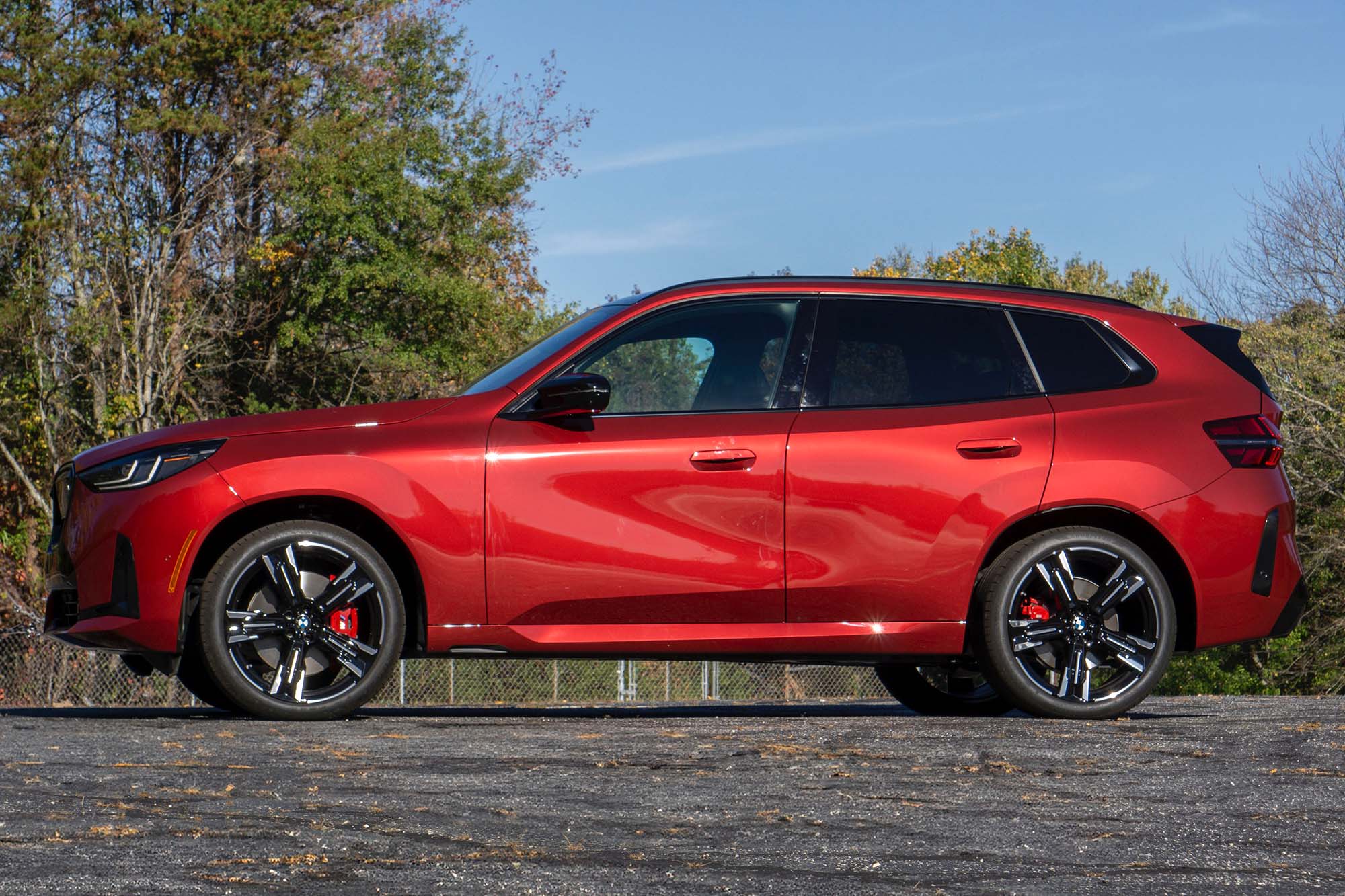 Side view of a red 2025 BMW X3