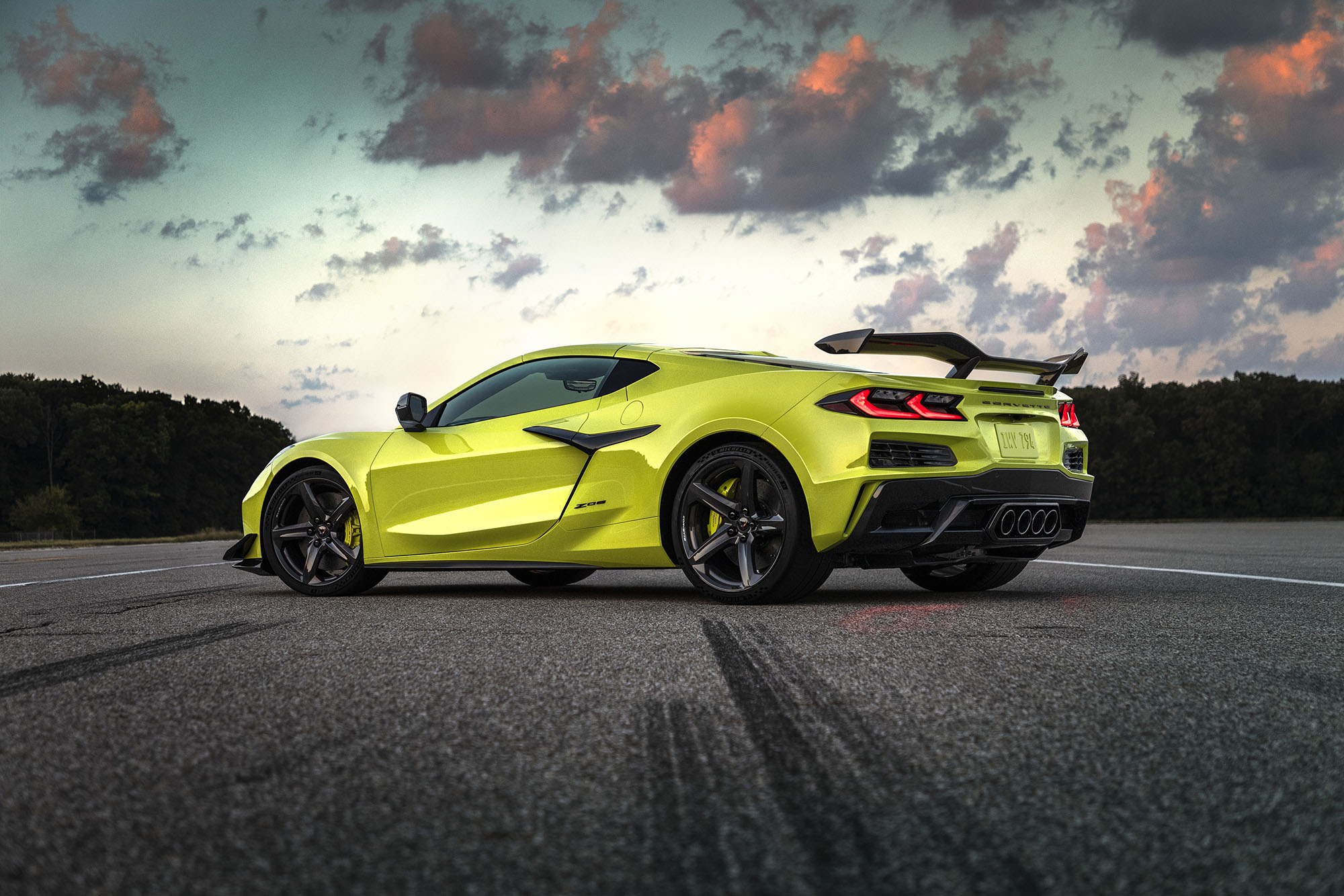 Yellow-green Corvette parked on a paved road