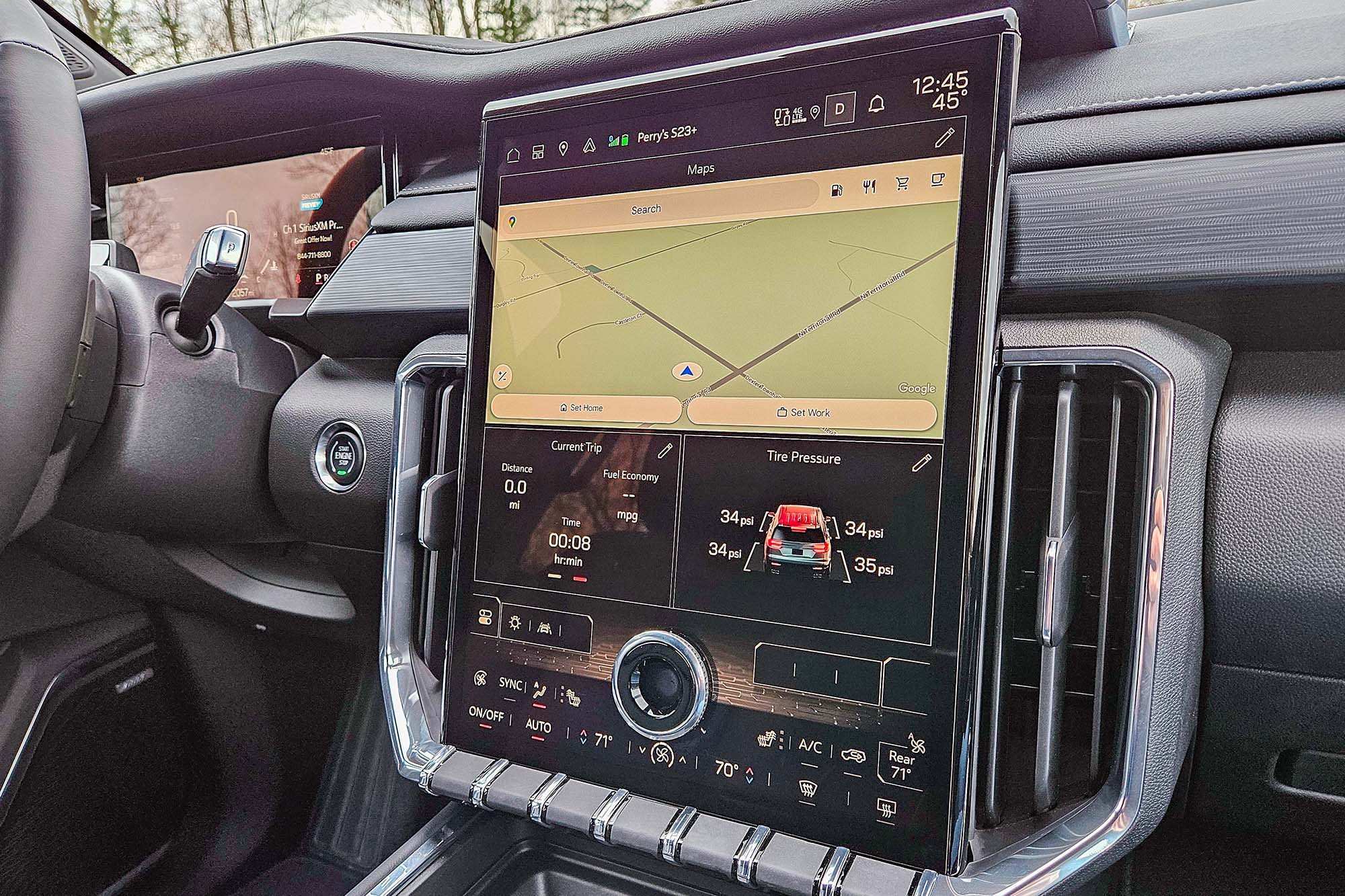 2024 GMC Acadia interior showing the safety features menu on the infotainment screen.