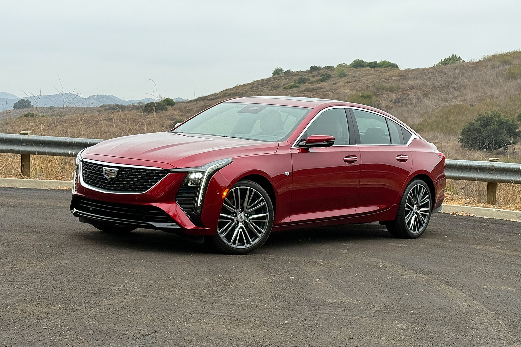 2025 Cadillac CT5 Premium Luxury in Radiant Red in front of a hillside