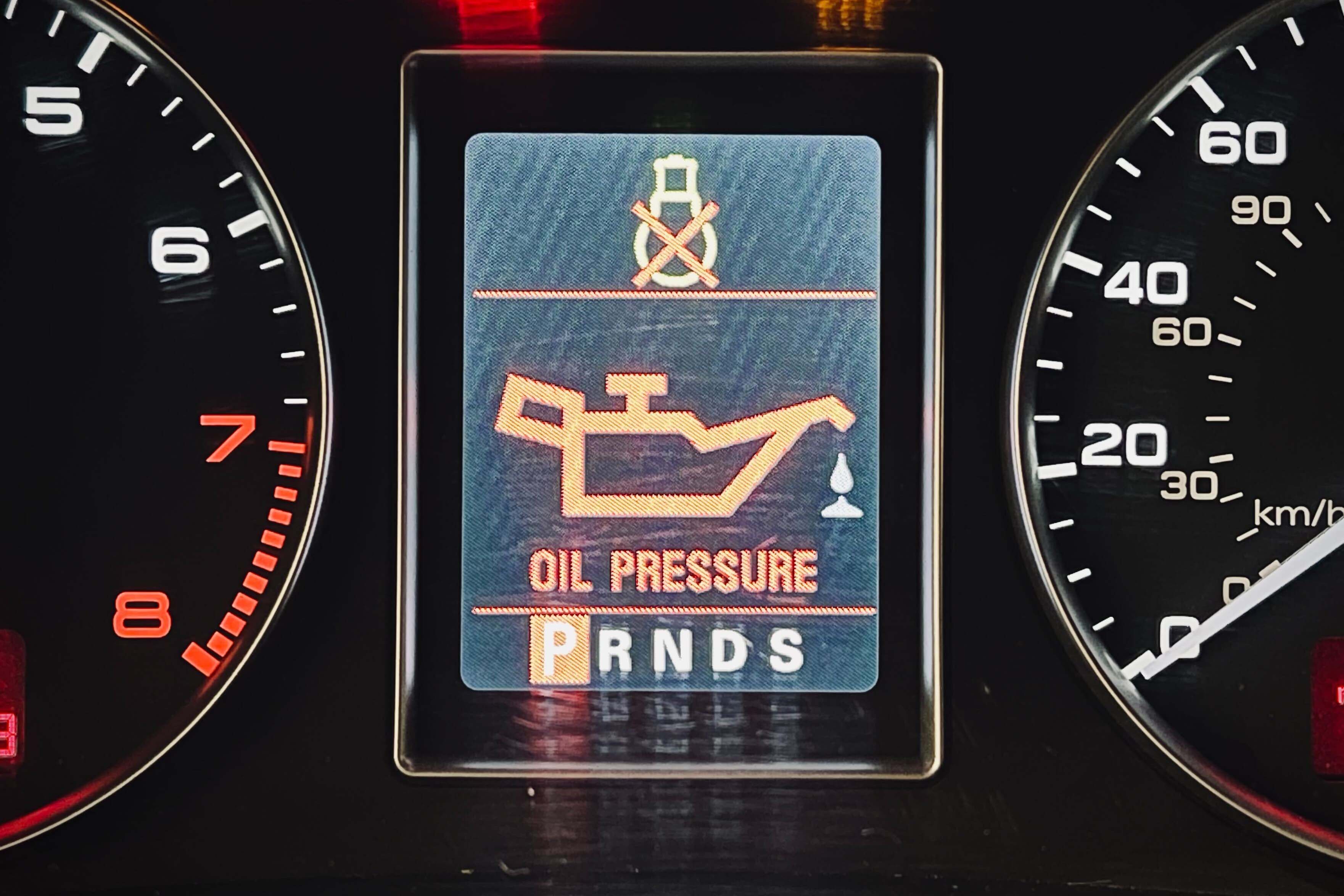 Dashboard of car with oil-pressure light illuminated