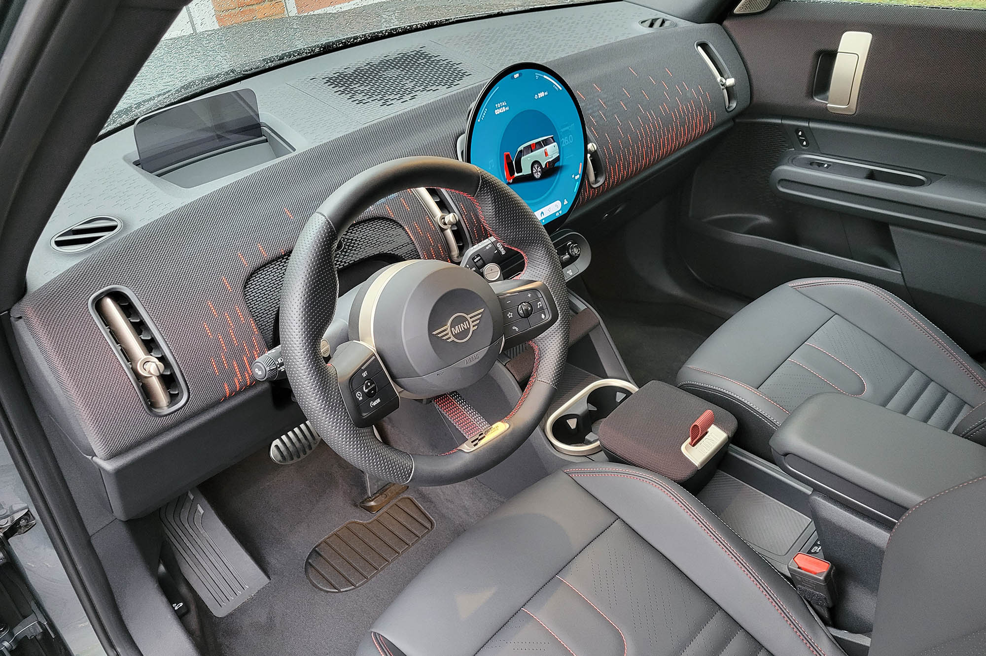 2025 Mini Countryman John Cooper Works interior showing the dashboard and front seats.