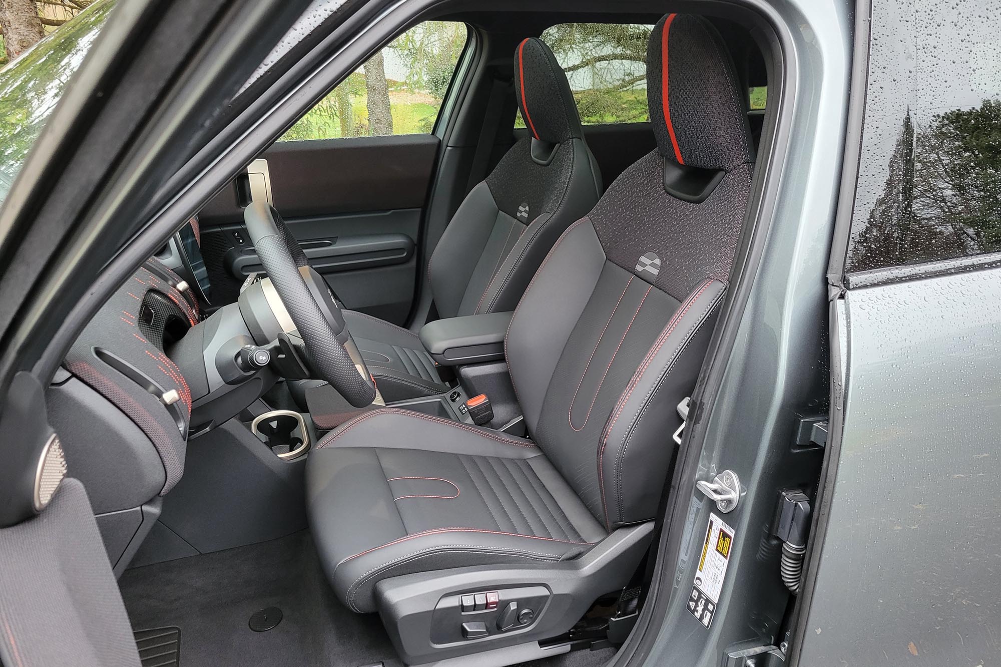  2025 Mini Countryman John Cooper Works interior showing the front seats.