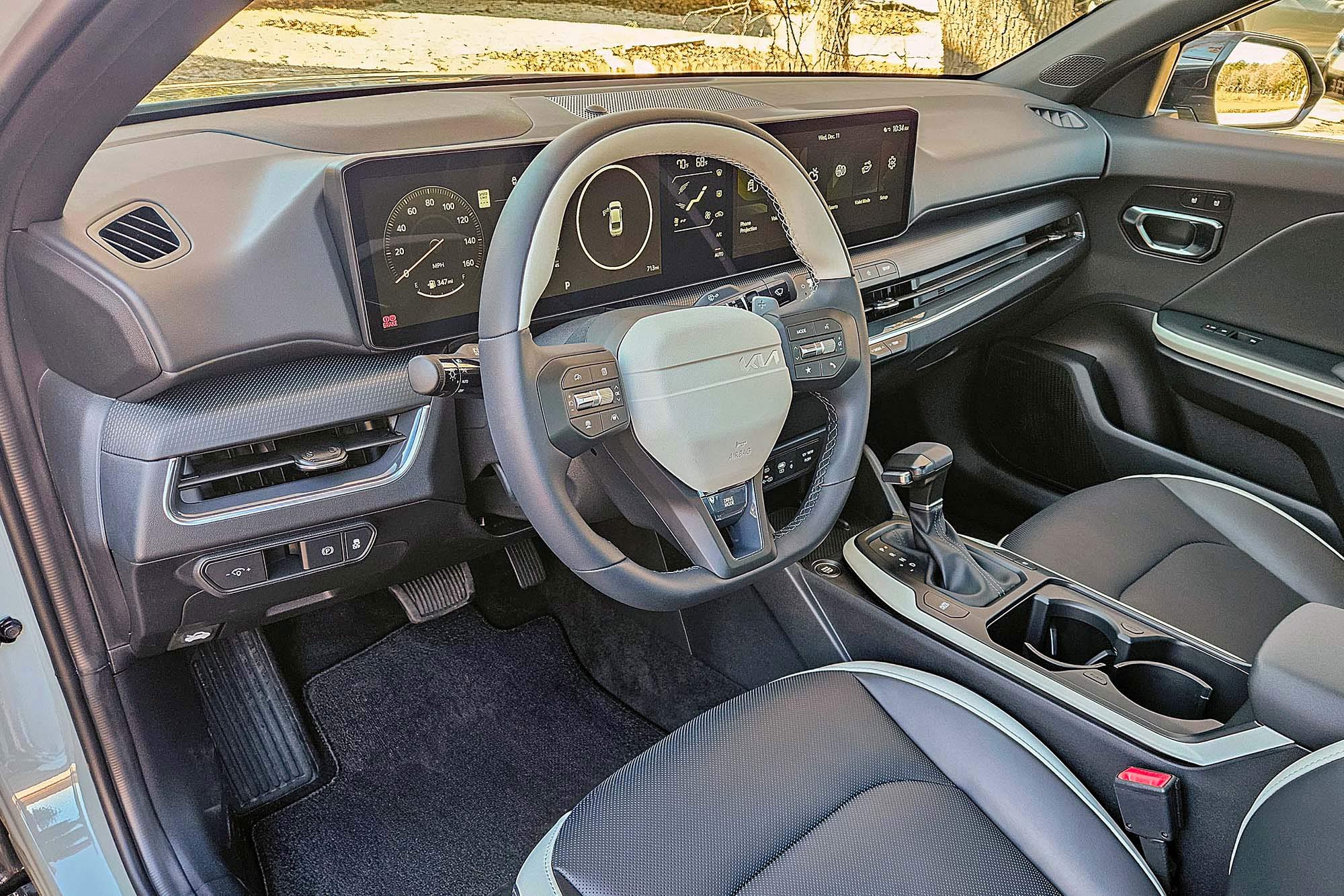 2025 Kia K4 GT-Line Turbo interior showing the dashboard, center console, and front seats.