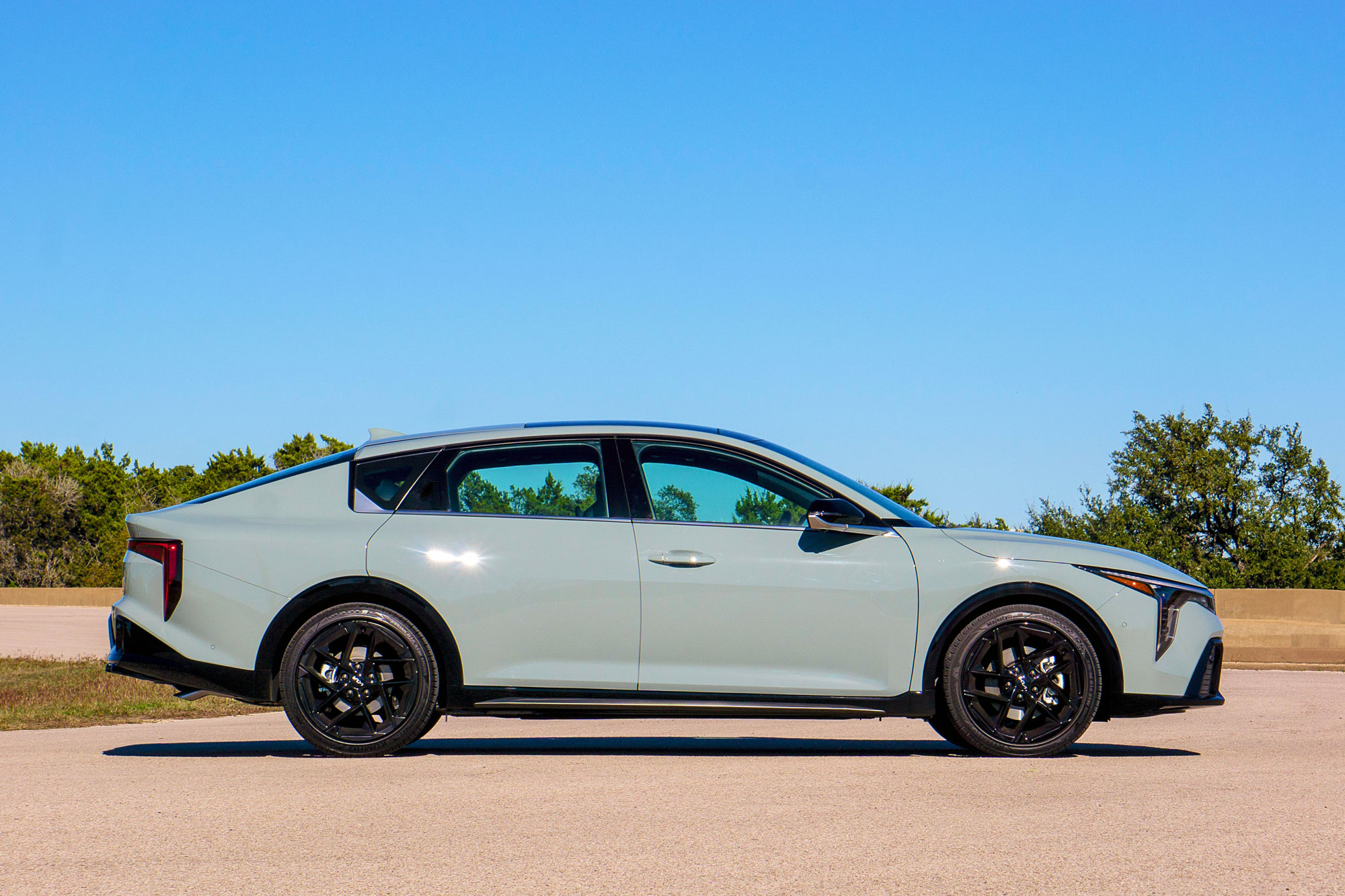 2025 Kia K4 GT-Line Turbo in Morning Haze, side profile.