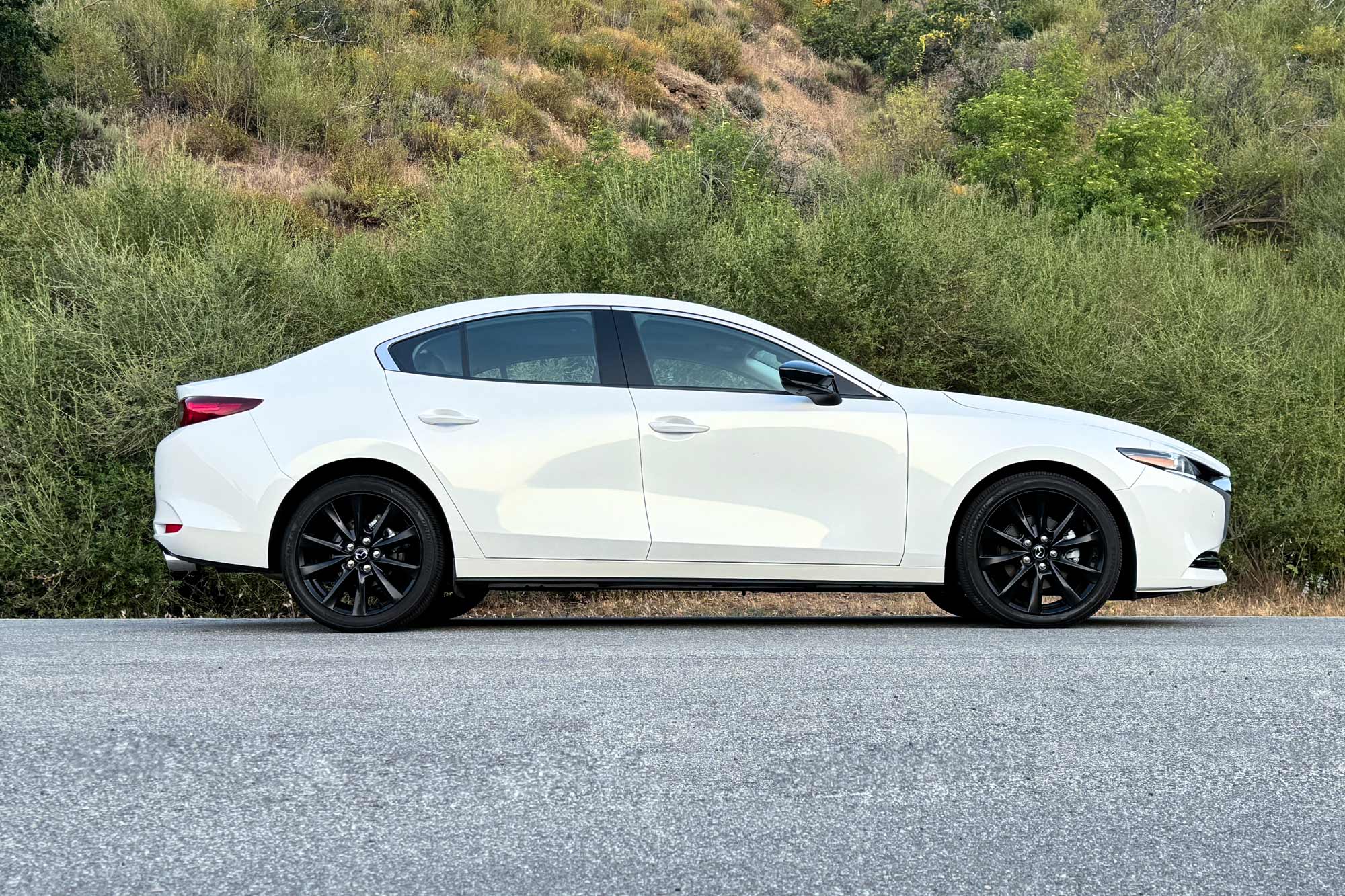 Side view of a white 2024 Mazda 3 2.5 Turbo Premium Plus.