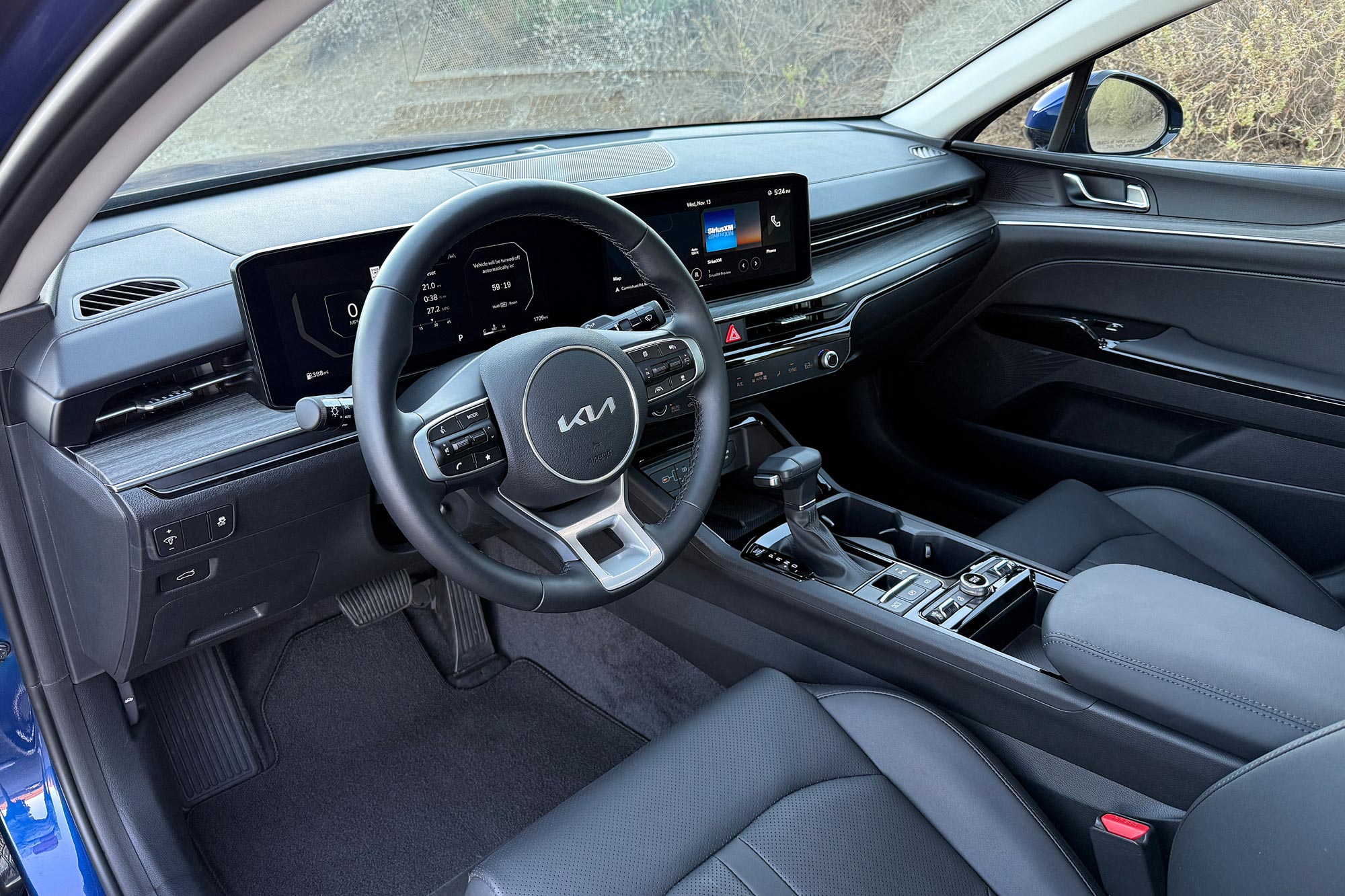 2025 Kia K5 EX interior showing the dashboard and center console.