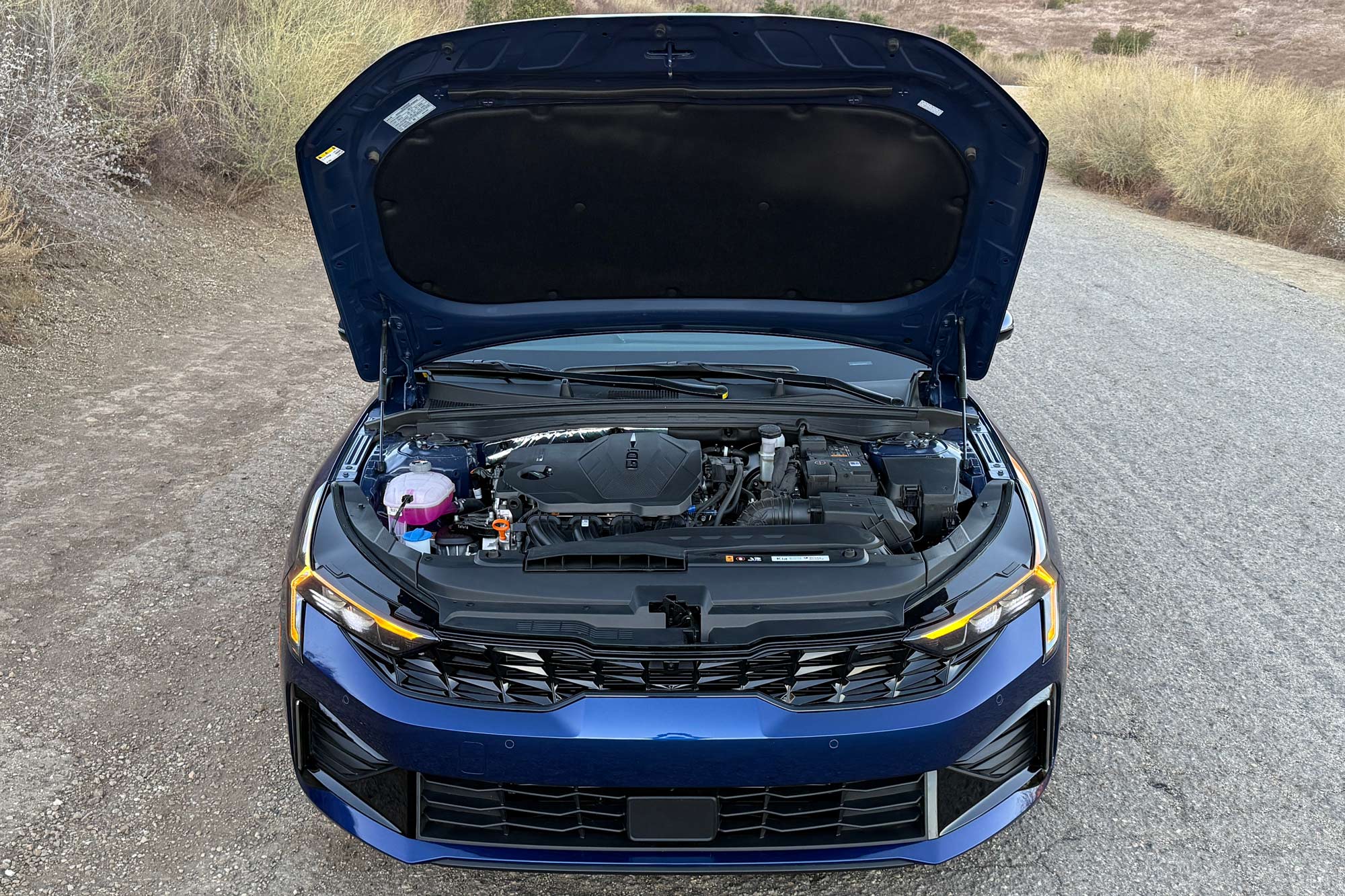 Blue 2025 Kia K5 EX engine bay