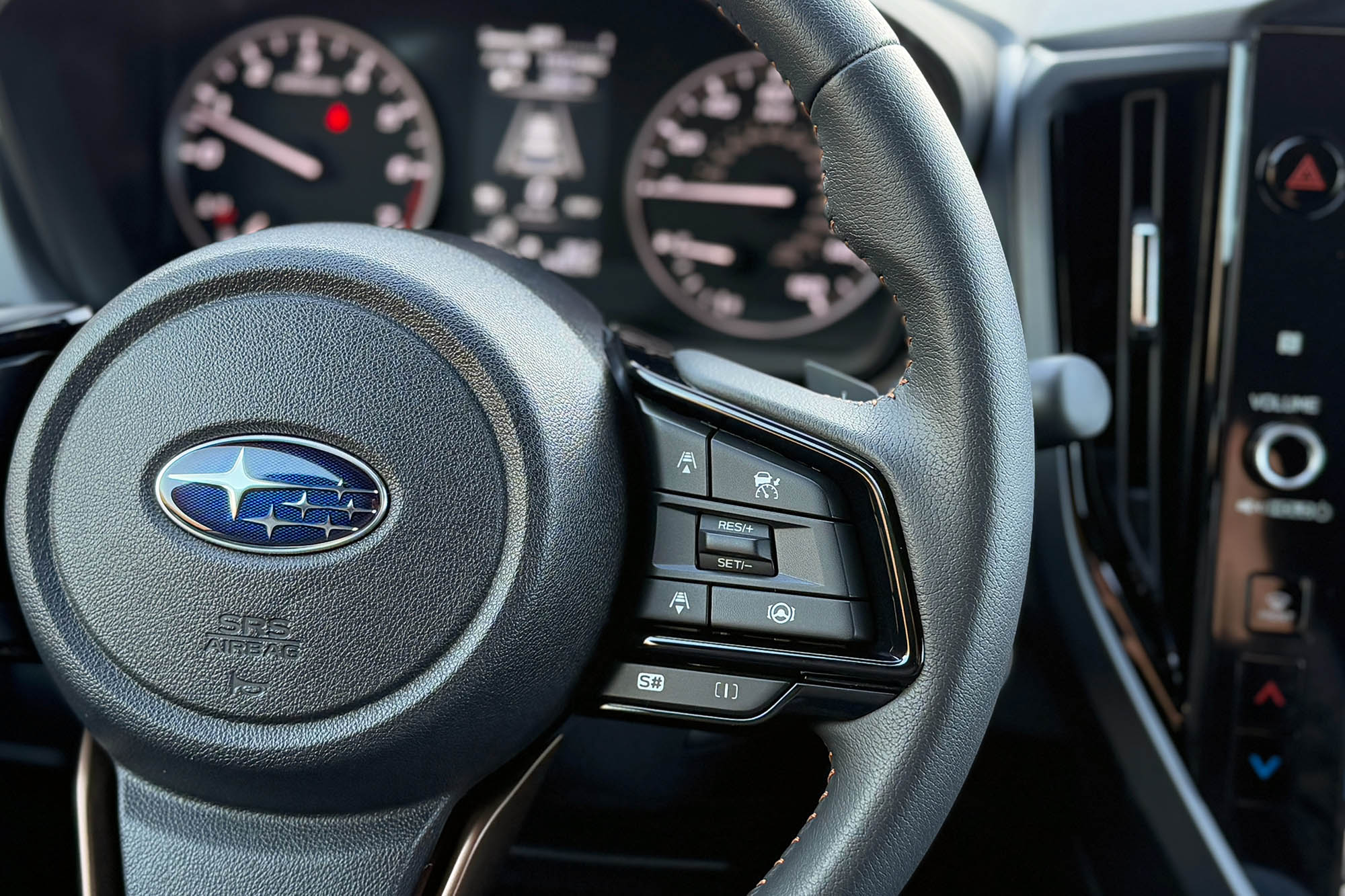 2025 Subaru Forester Sport interior showing the safety feature controls on the steering wheel.