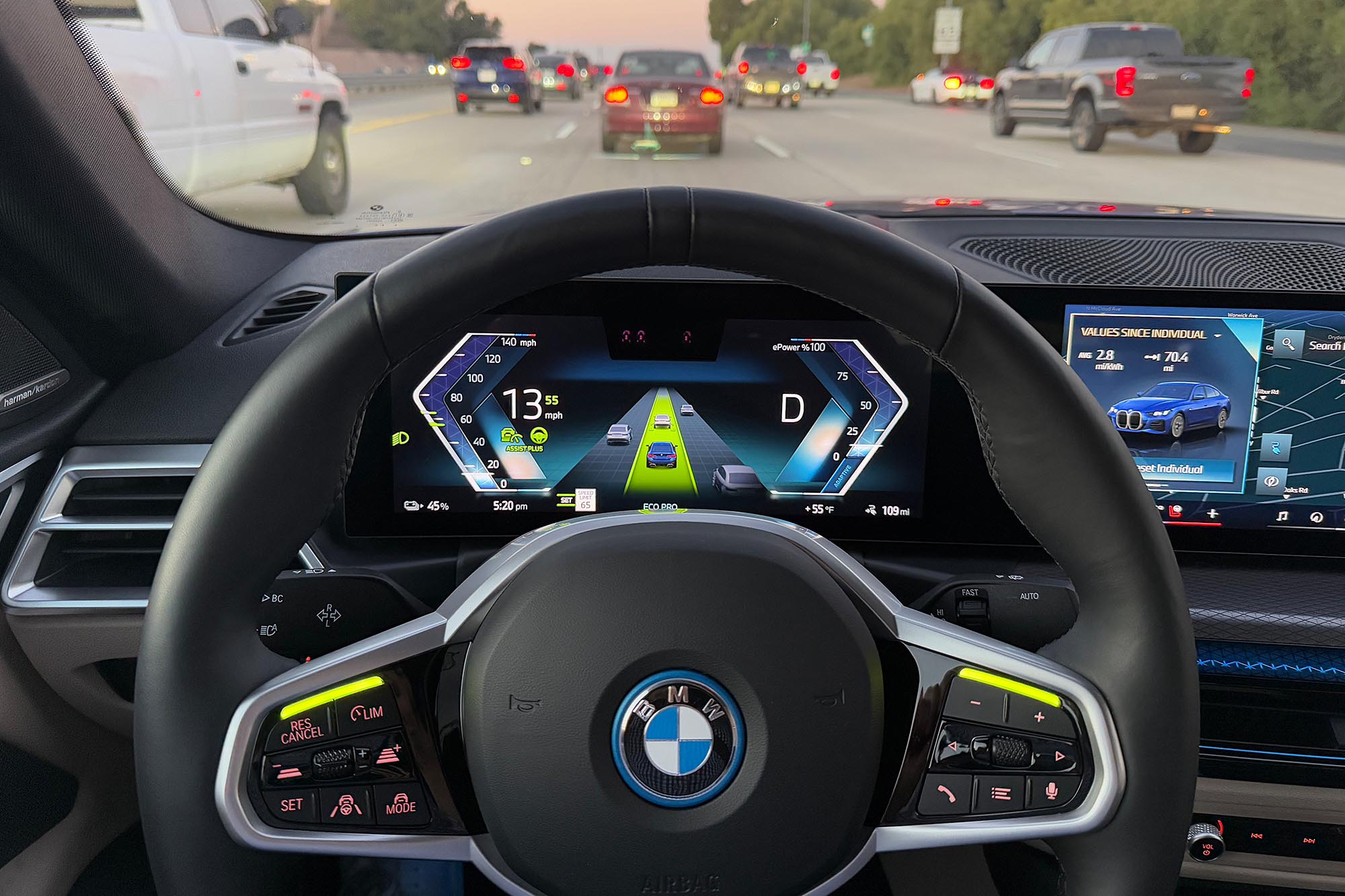 2025 BMW i4 eDrive40 interior showing the Assisted Driving Plus system active in traffic.