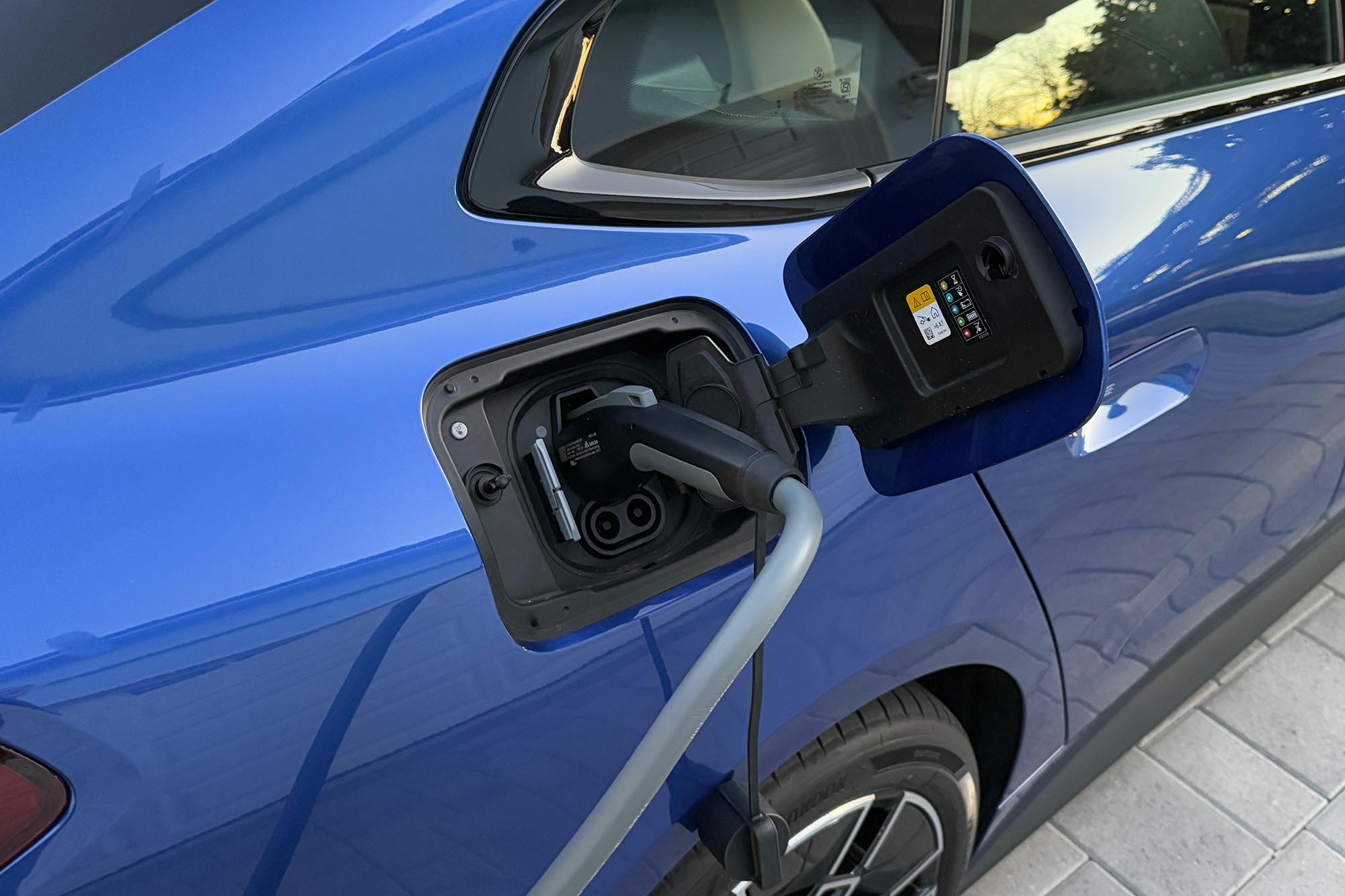 2025 BMW i4 eDrive40 showing the power port and vehicle charging cord.