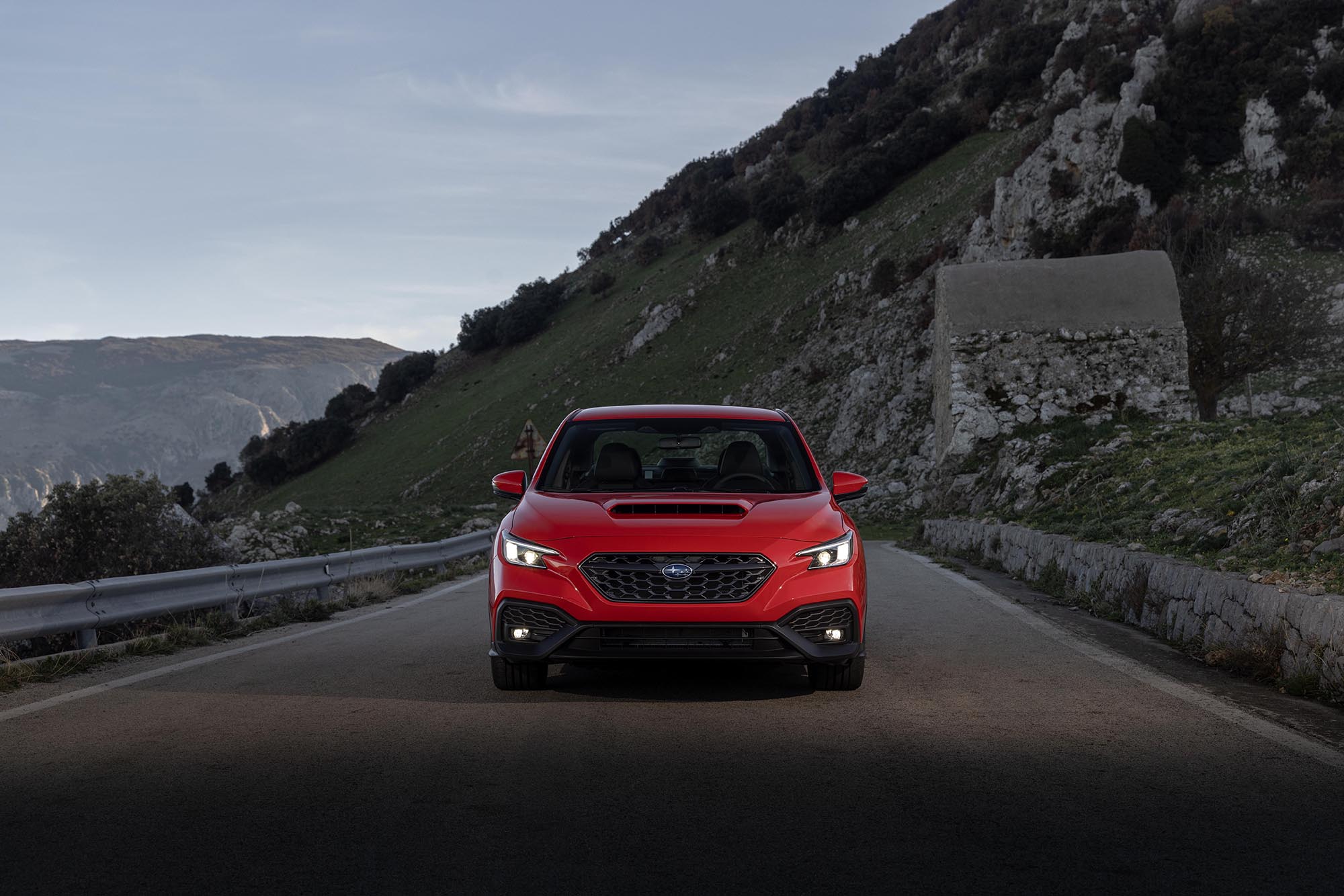 2024 Subaru WRX in red on a mountain road