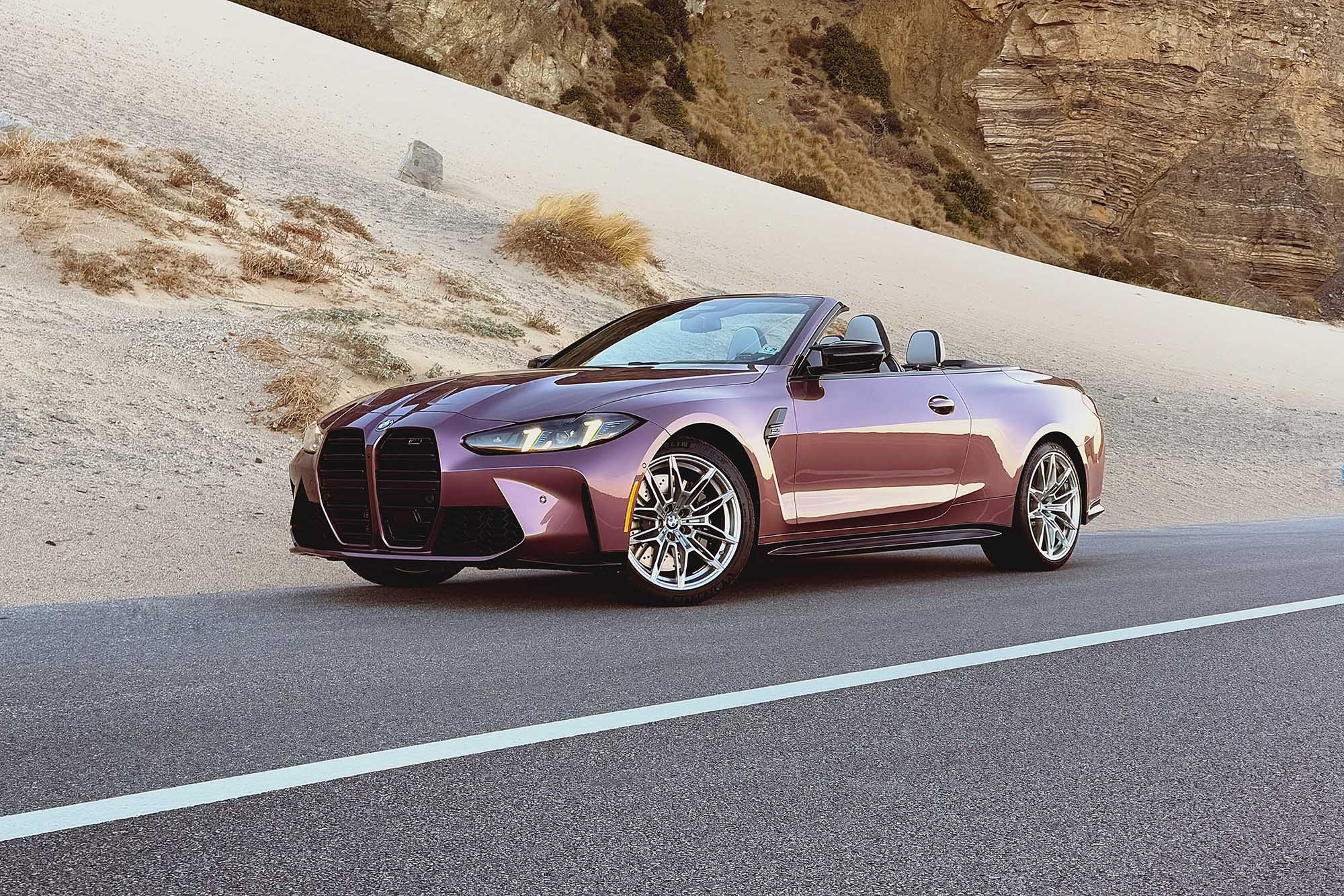 2025 BMW M4 Competition xDrive Convertible in Velvet Orchid in front of a sand dune and a mountain