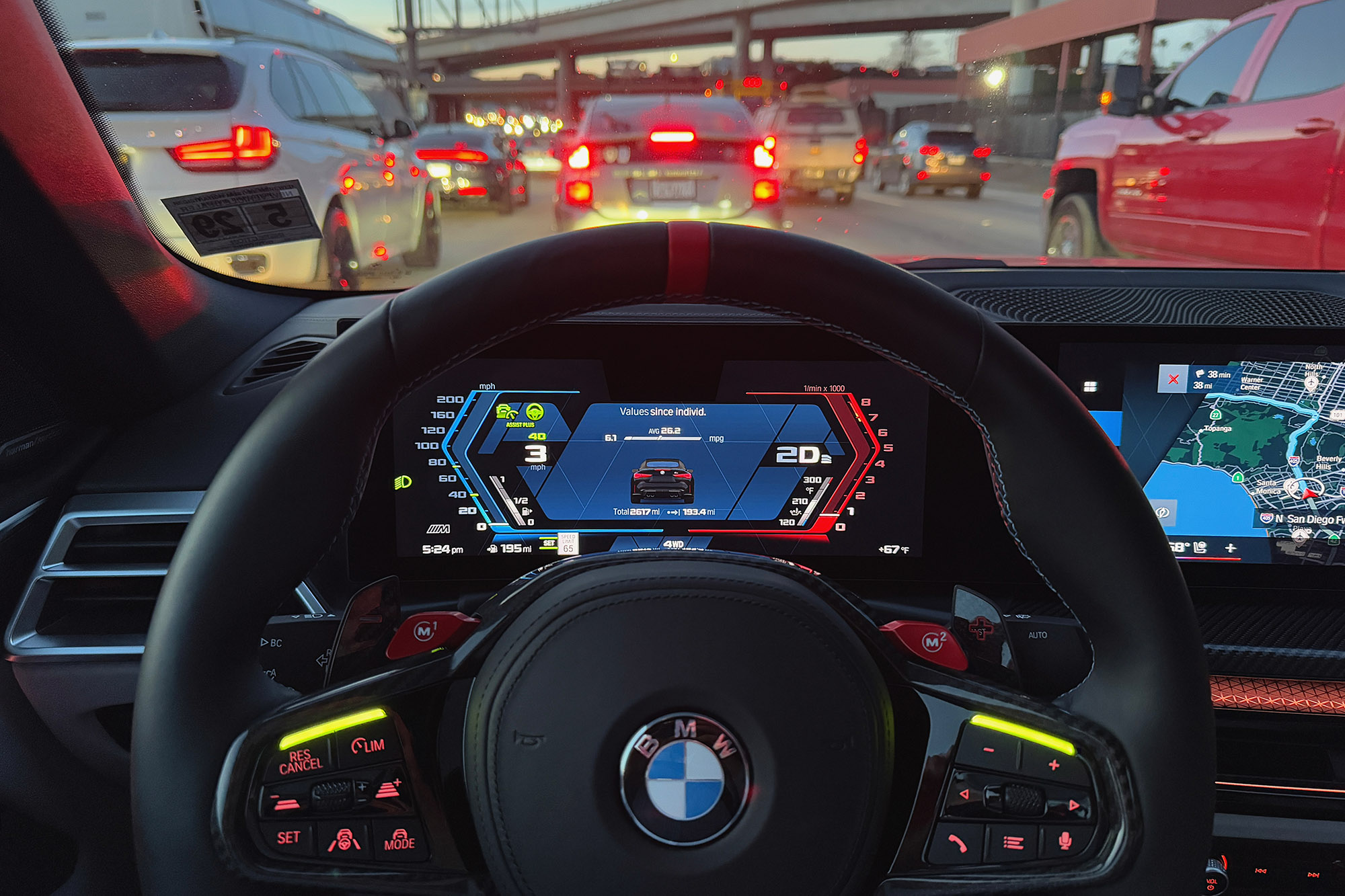 2025 BMW M4 Competition xDrive Convertible interior showing the Assisted Driving Plus technology active in Los Angeles traffic