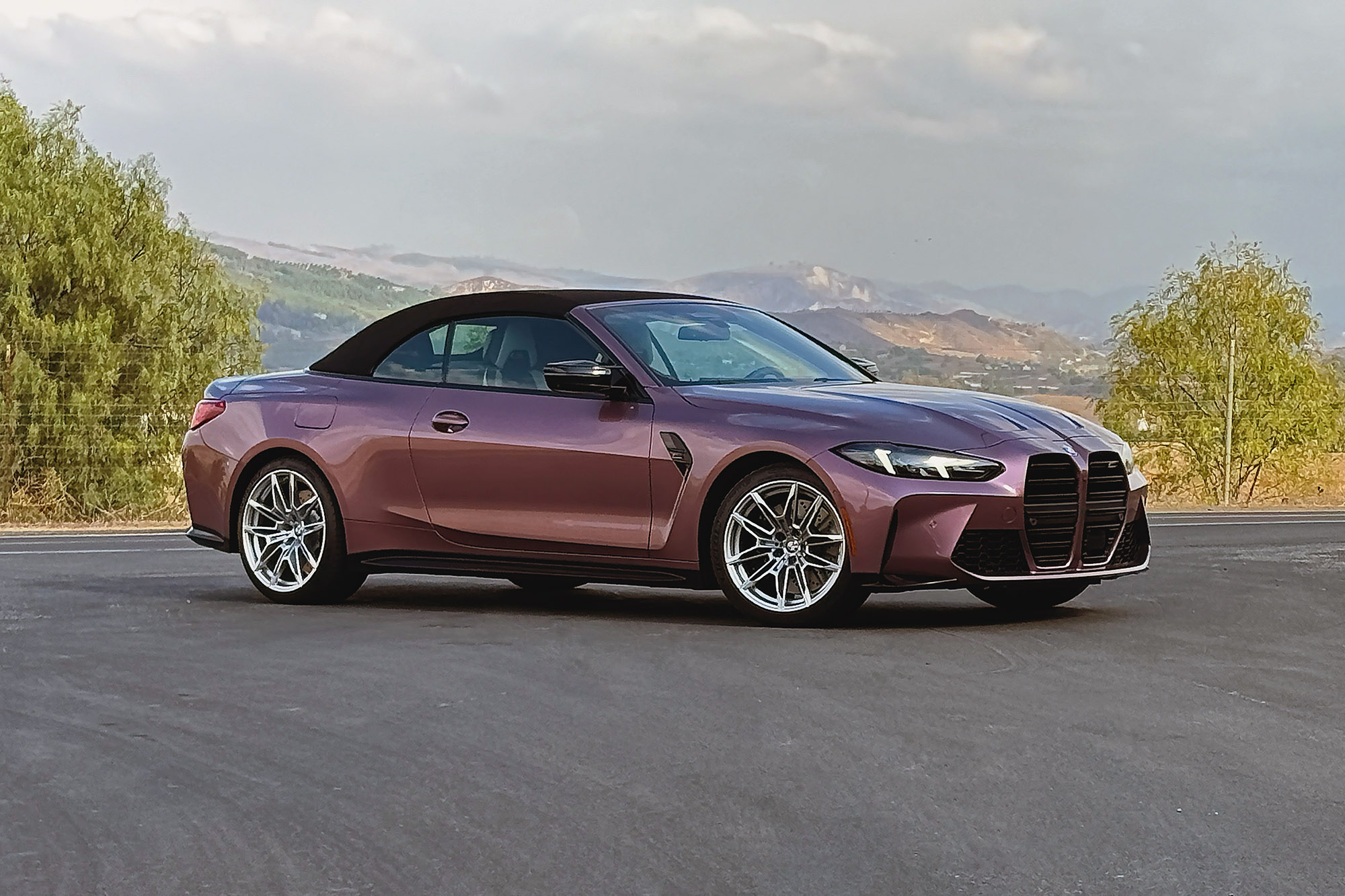 2025 BMW M4 Competition xDrive Convertible in Velvet Orchid with the top up